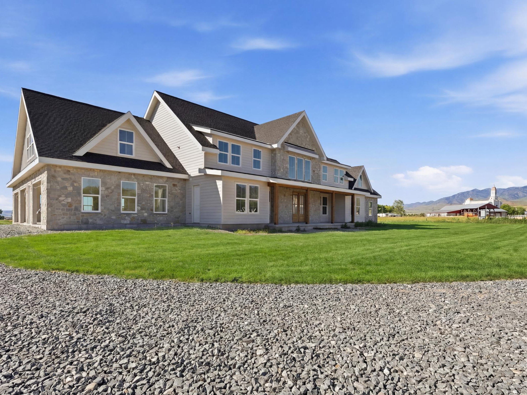 Stone and siding exterior with a dark shingle roof