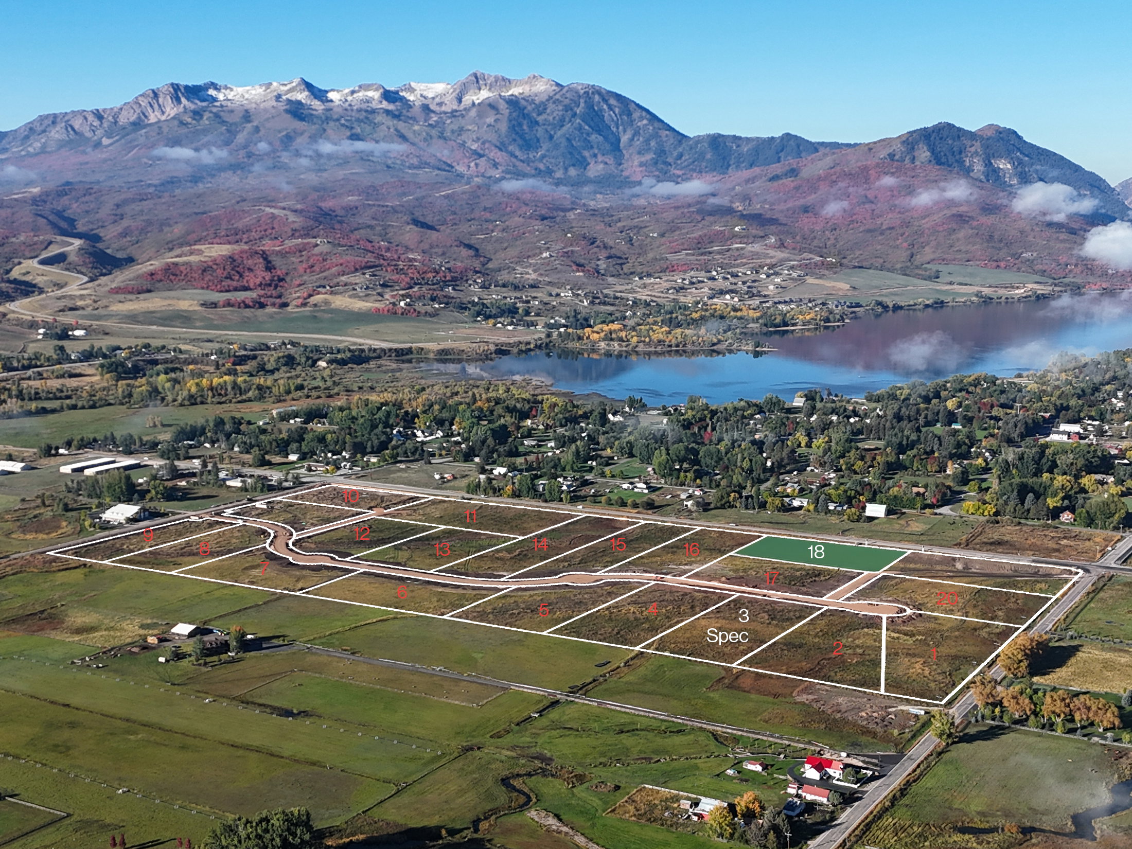 Developed land parcels featuring a paved road infrastructure and marked lot boundaries