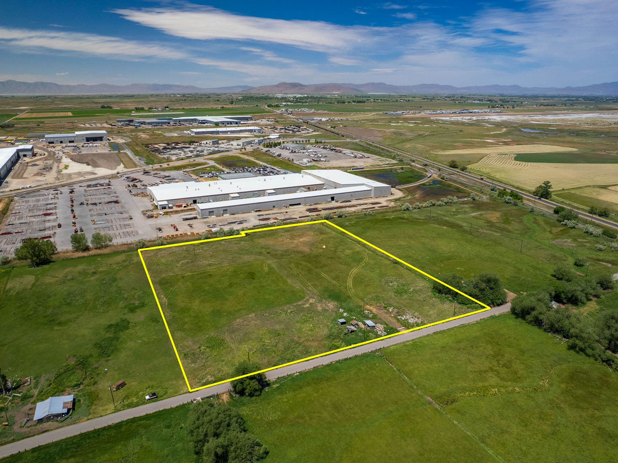 Expansive undeveloped land parcel with marked boundaries. Expansive green space featuring three parcels including Parcel # 03-077-0015, and adjacent parcels available for sale MLS# 2163865 (Parcel #'s 03-077-0011 and 03-077-0012) for a footprint of 8.94 A