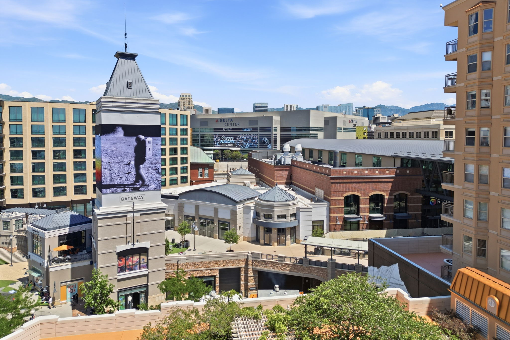 Urban landscape featuring commercial and residential buildings under a clear sky