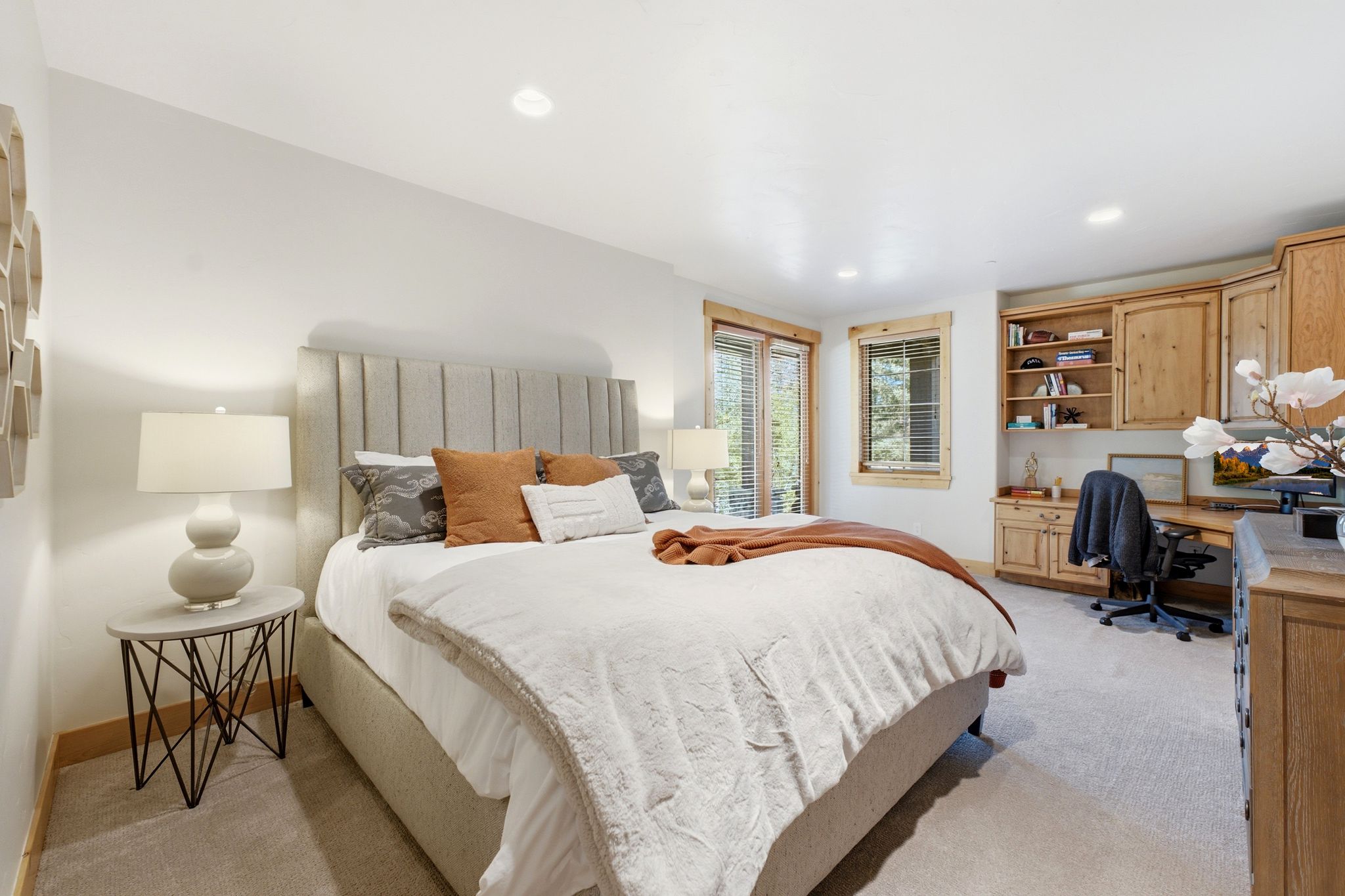 Spacious room with a neutral carpet, recessed lighting, and white wall finishes