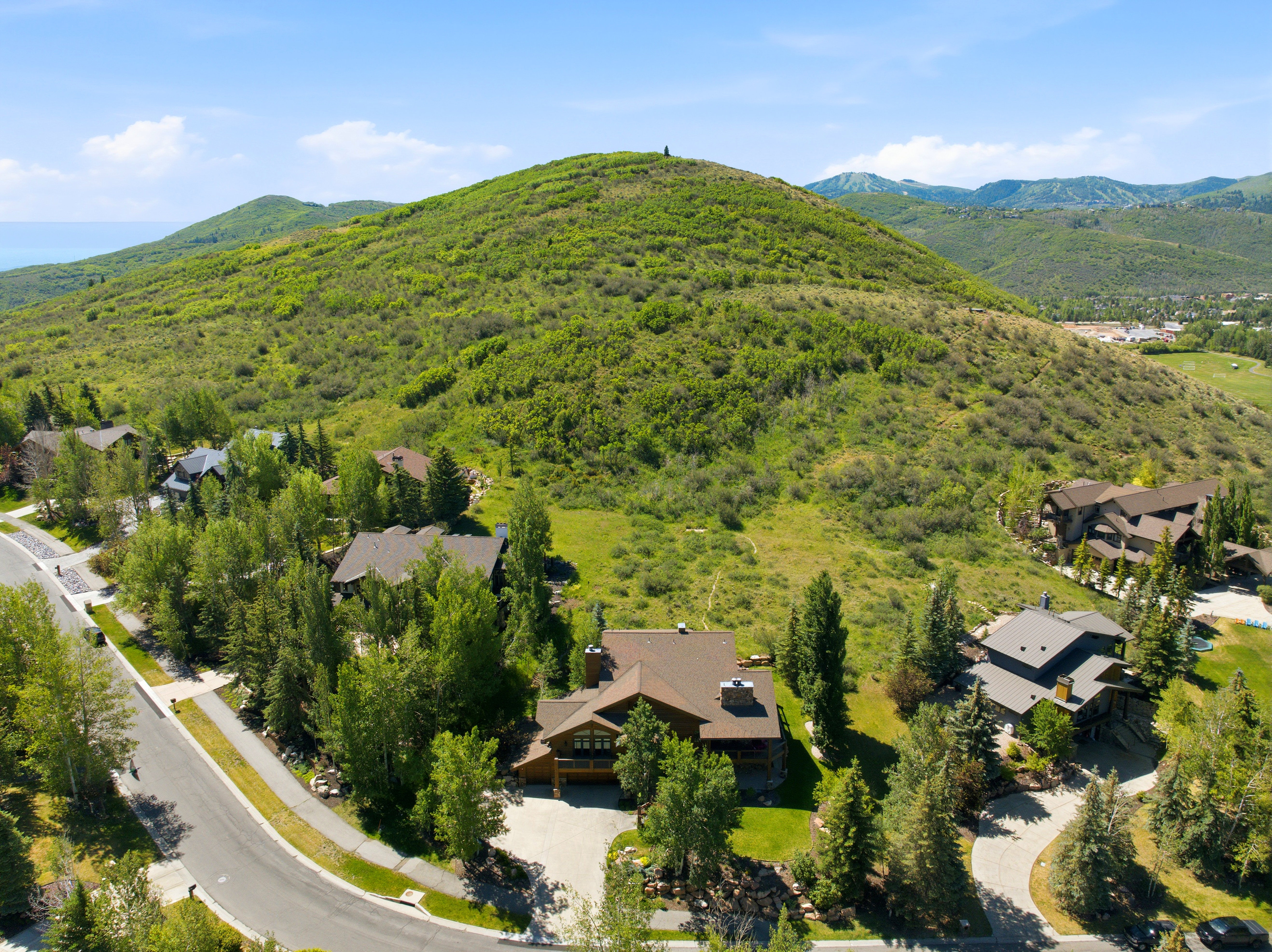Expansive property with a verdant hillside backdrop