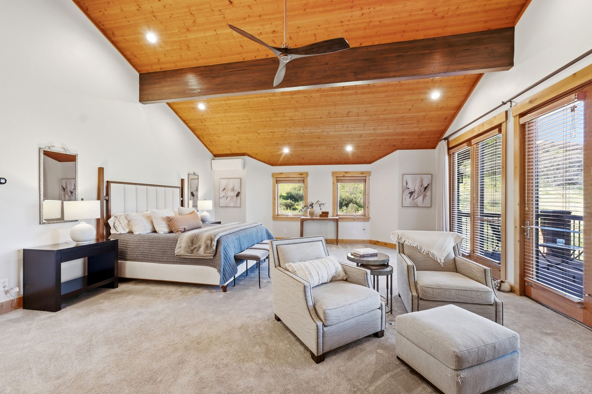 Vaulted wood-paneled ceiling with exposed beam