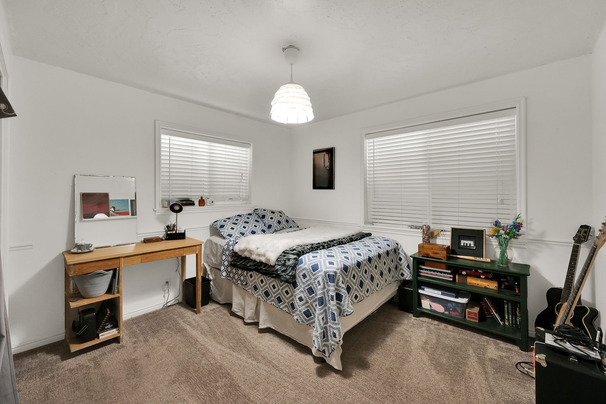 Bright room with neutral carpet flooring and white walls