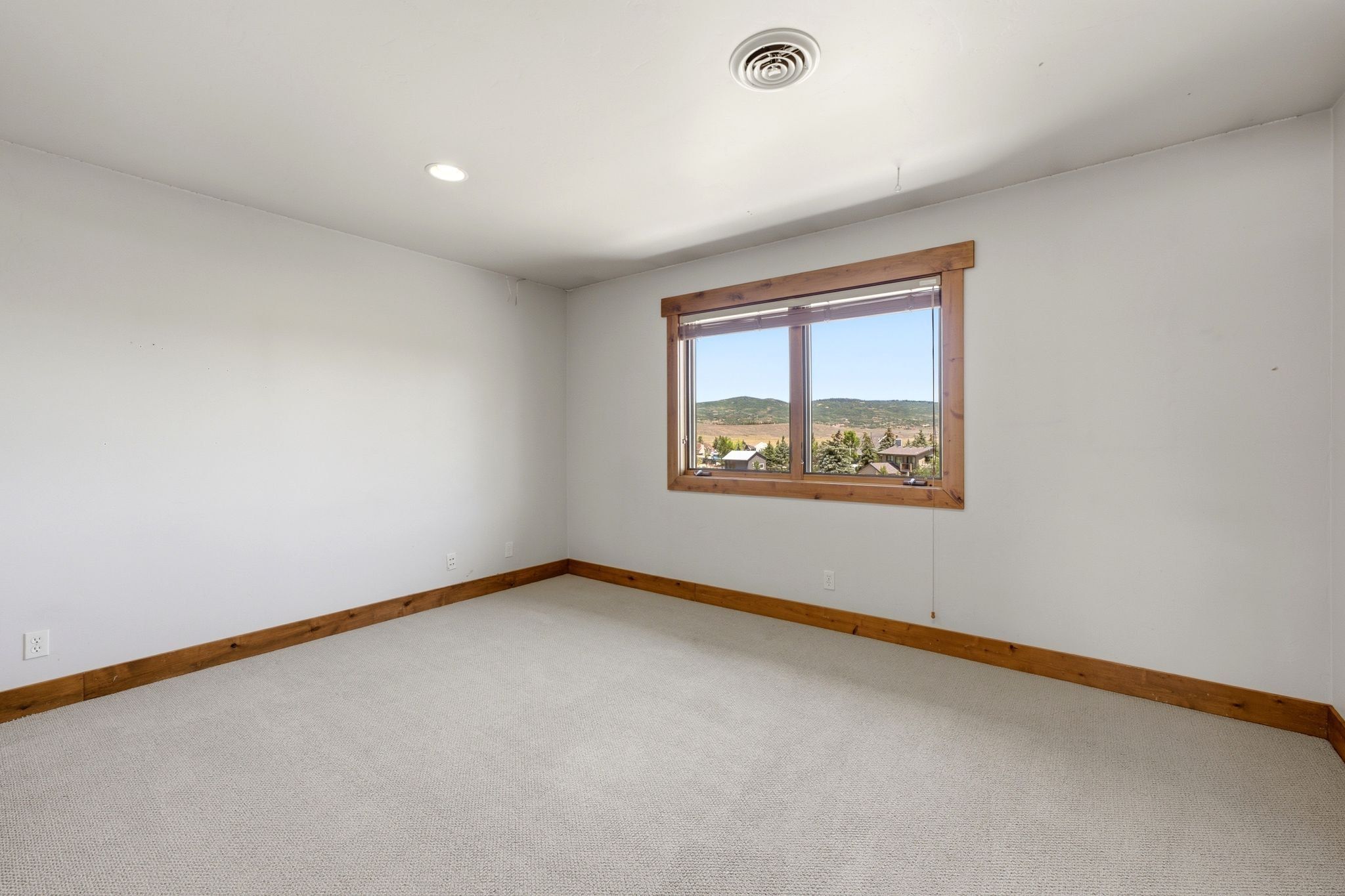 Room featuring light-toned carpeting and white walls