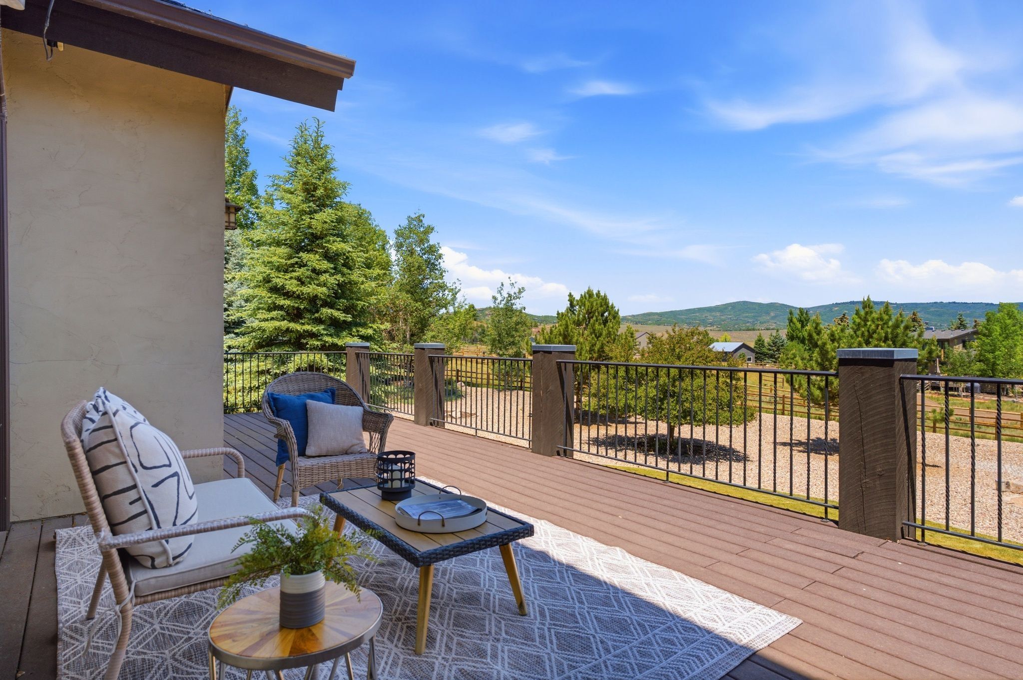 Expansive outdoor deck featuring composite decking and a black metal railing system