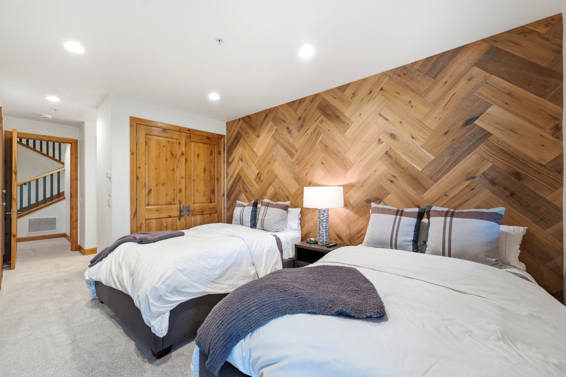 Feature wall with herringbone wood-finish detailing