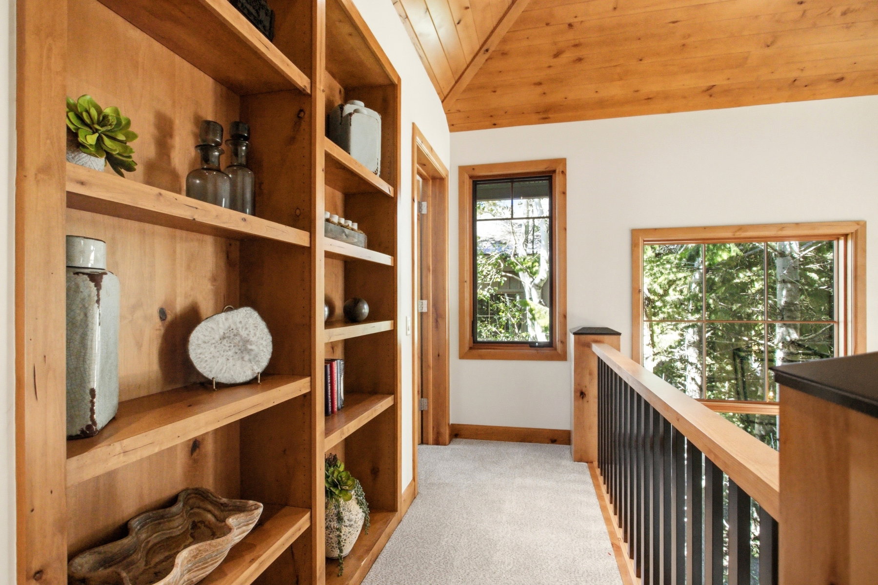 Built-in wood shelving providing extensive storage