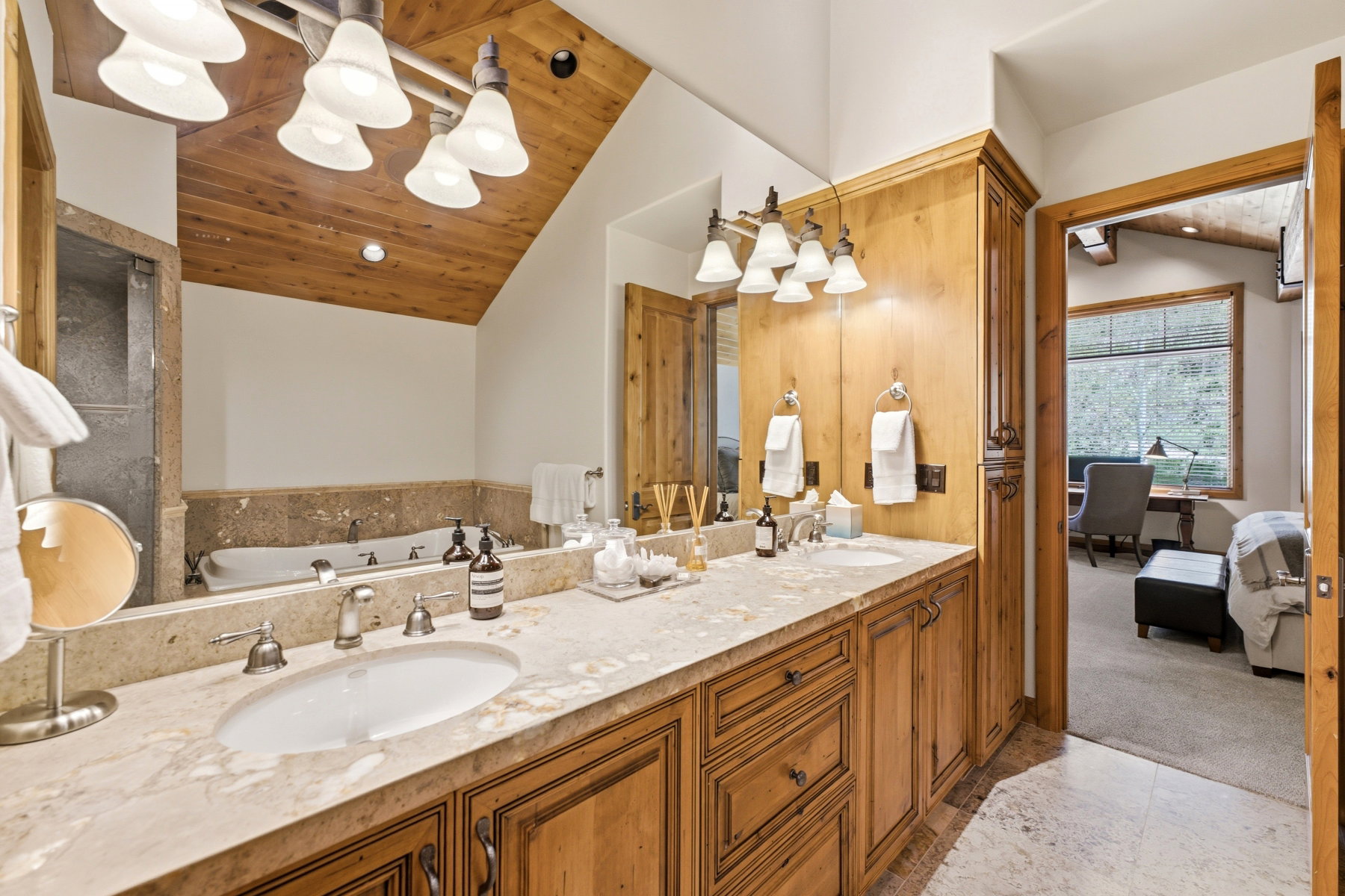 Double vanity with stone countertop and integrated sinks