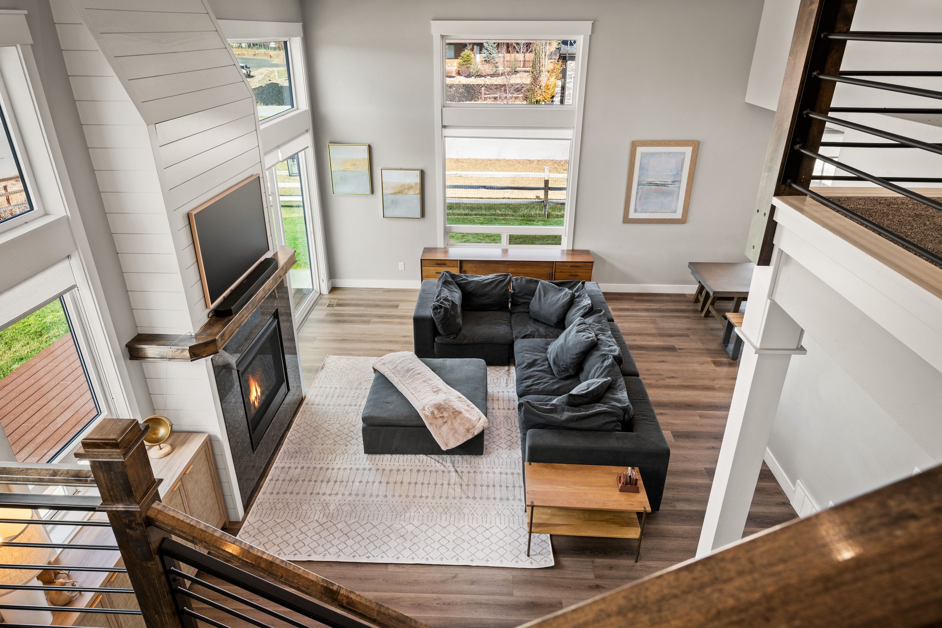 Two-story living area with wood-finish flooring