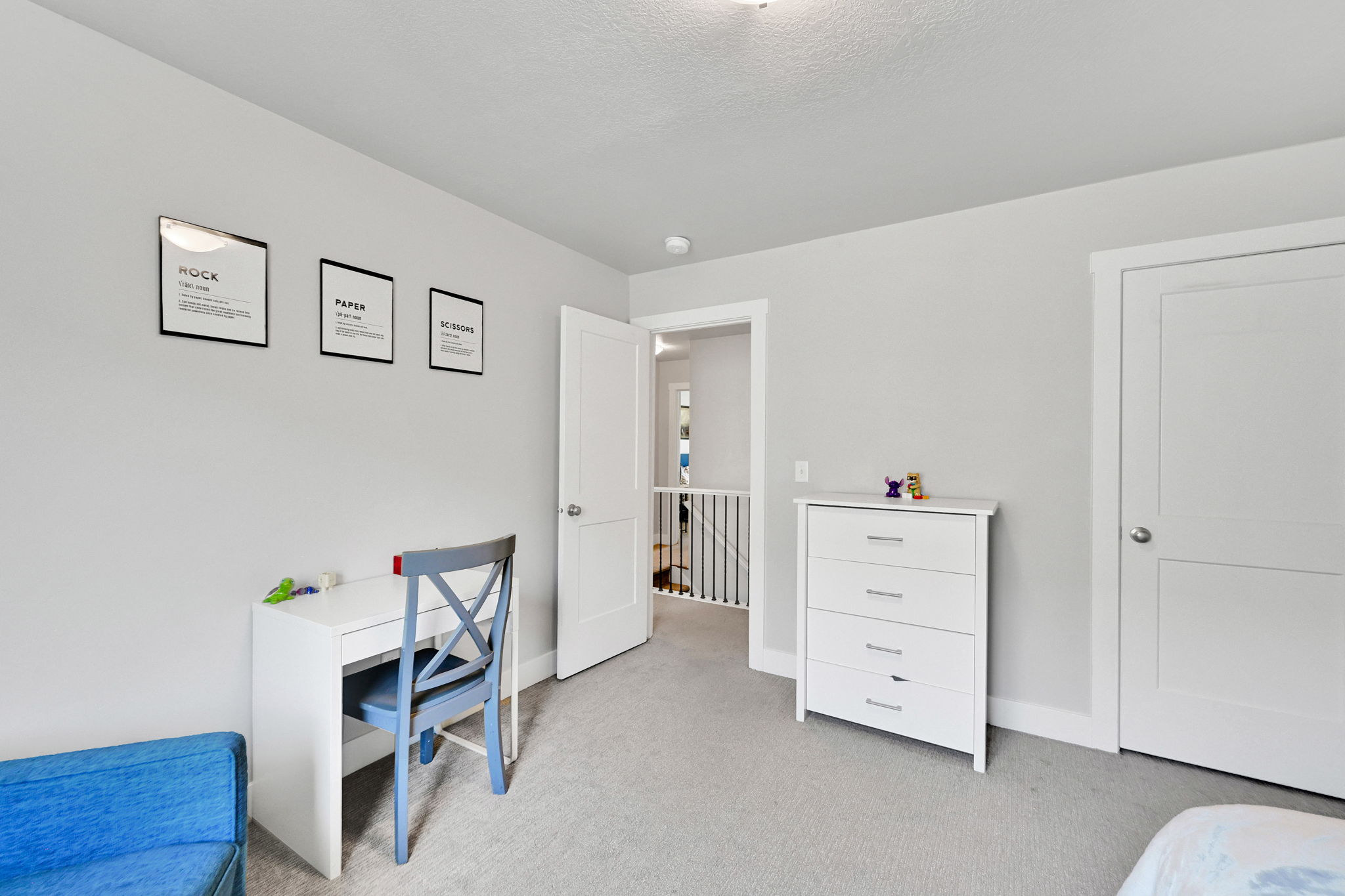 Light gray wall paint complemented by white trim and doors