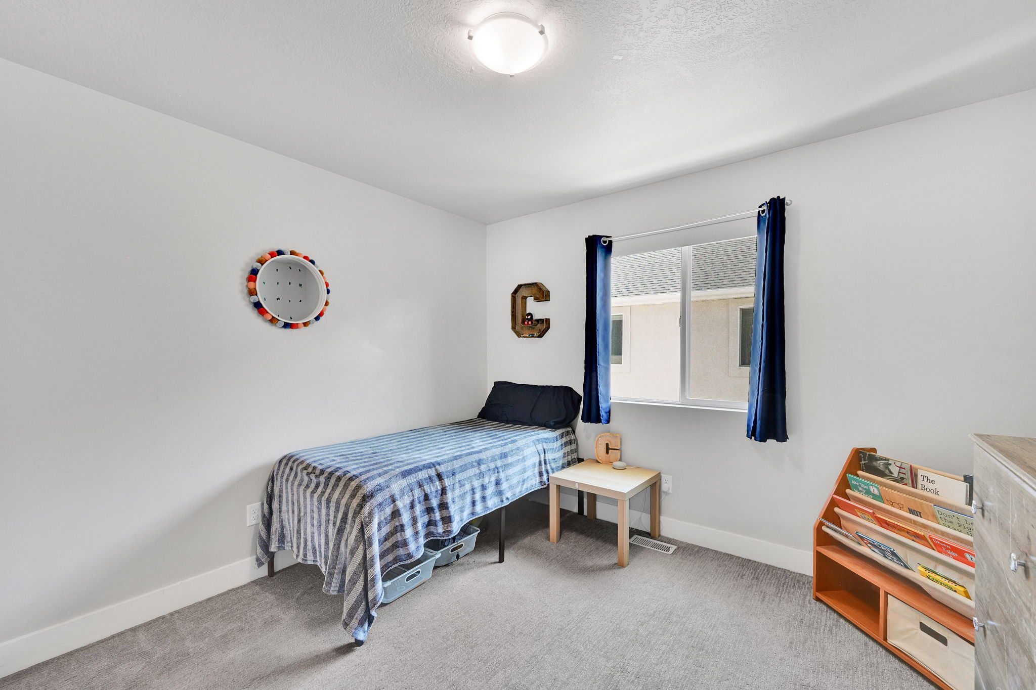 Light gray carpet flooring and white painted walls