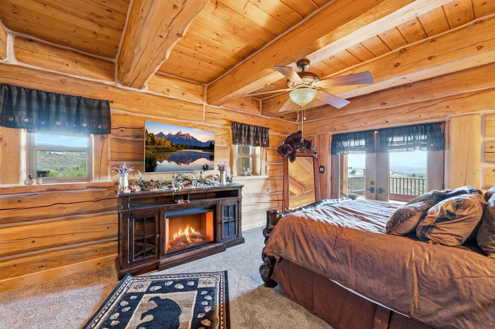 Log construction interior featuring exposed wood beam ceilings and wood plank walls
