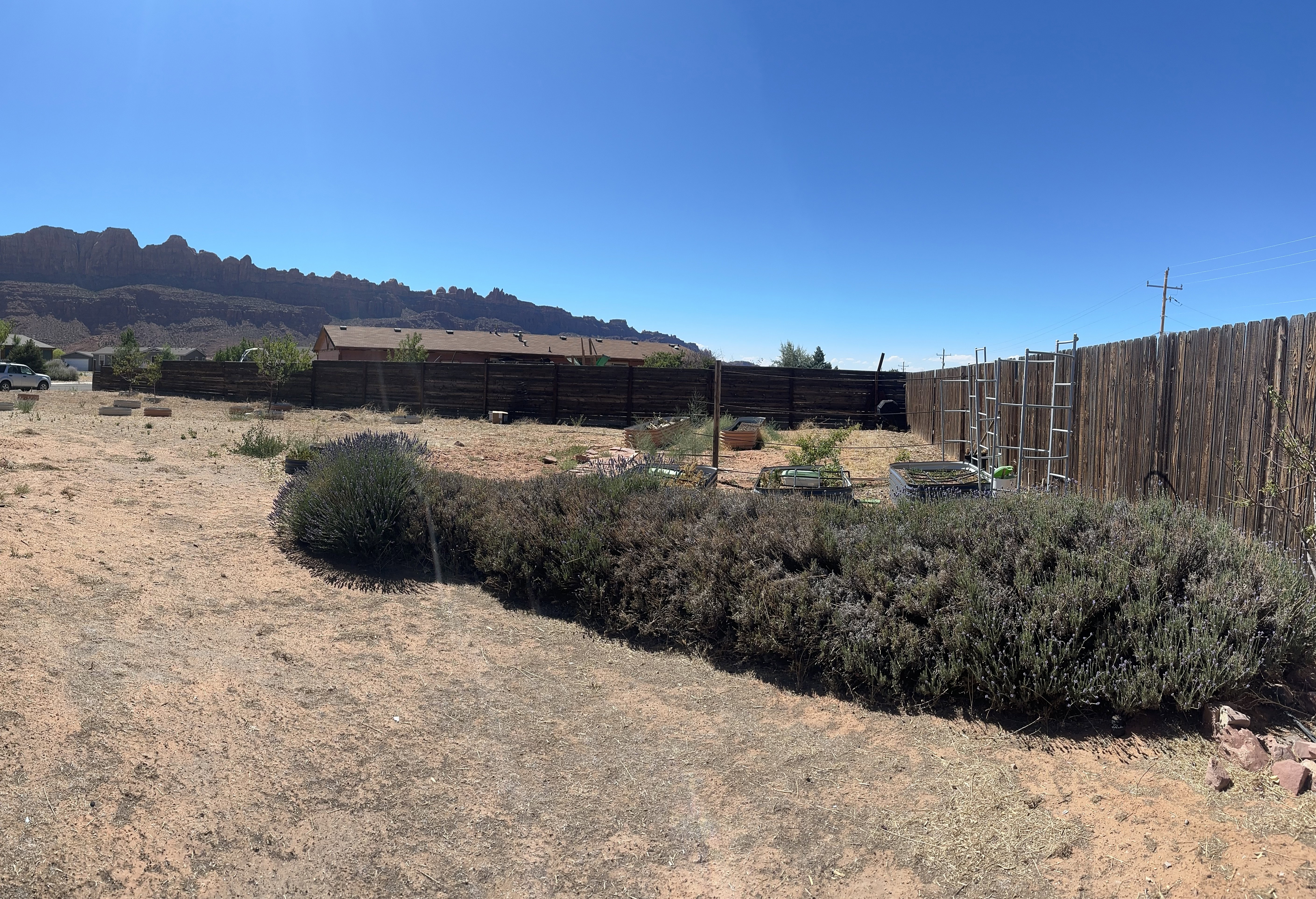 Expansive yard with a partial wood privacy fence
