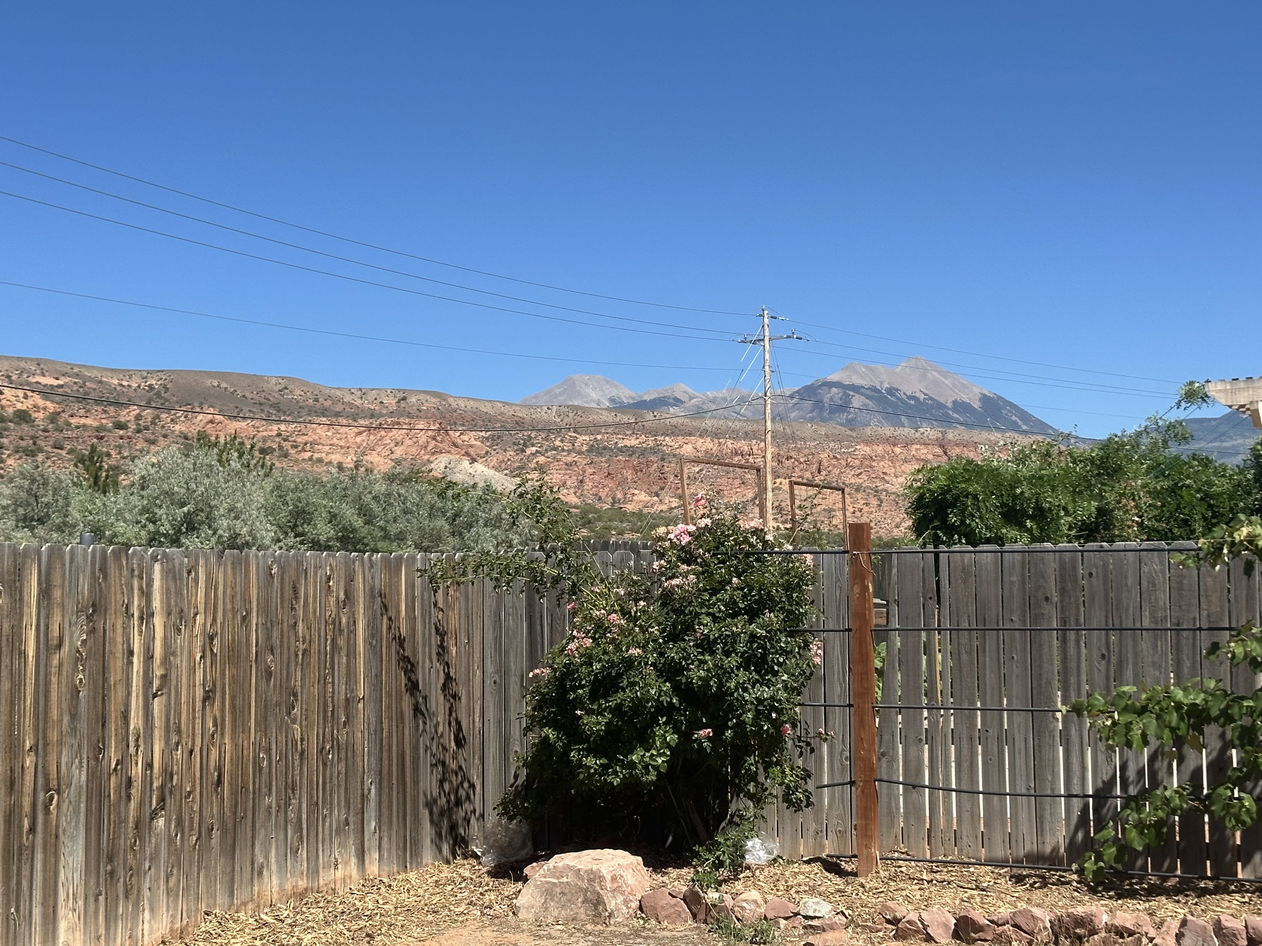 Mountain backdrop featuring peaks and red rock formations