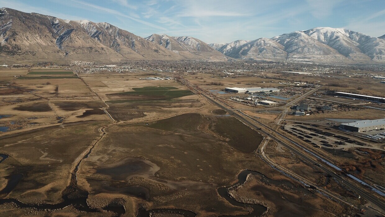 Expansive mountain range backdrop featuring snow-capped peaks