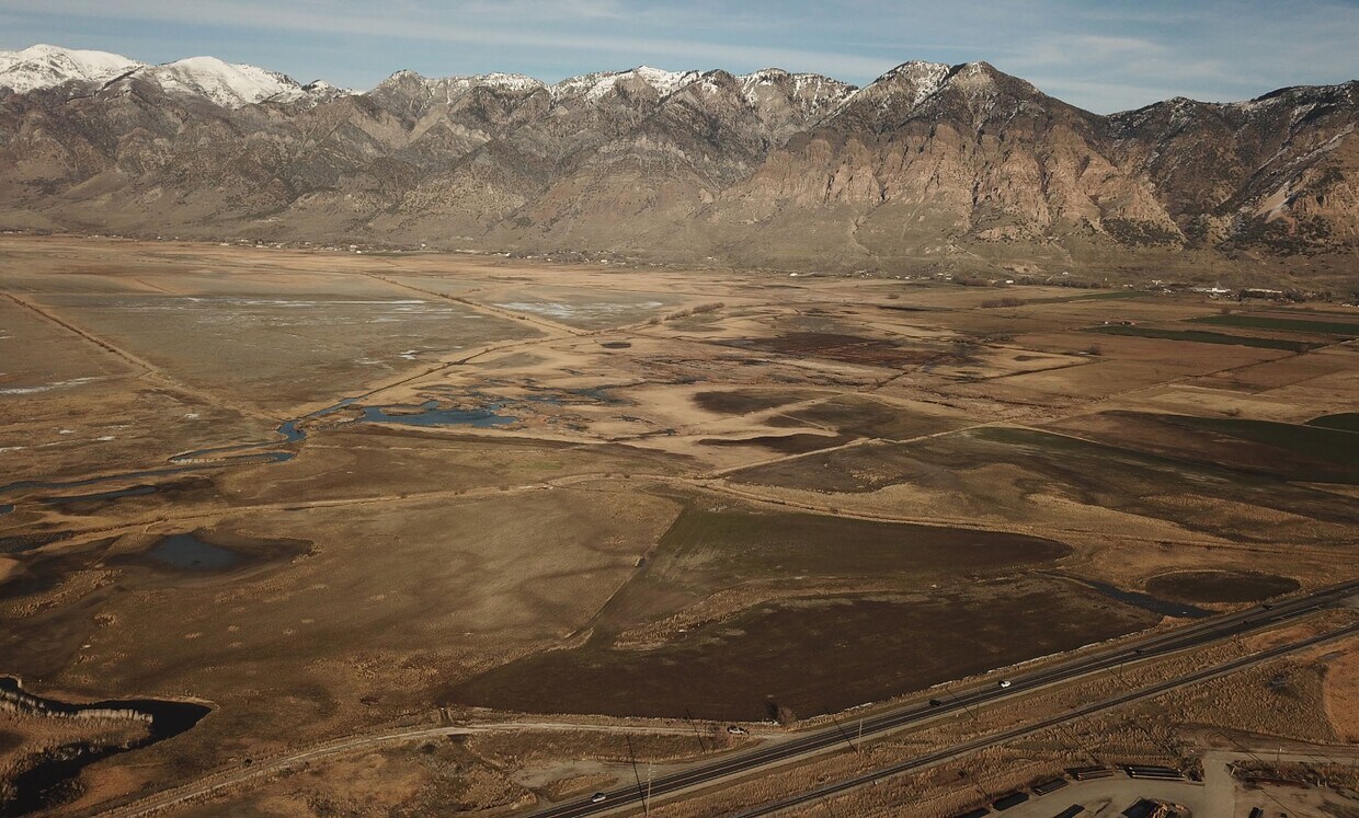 Expansive land parcel featuring natural waterways and varied terrain