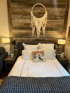Wood-finish accent wall providing a striking focal point for the room