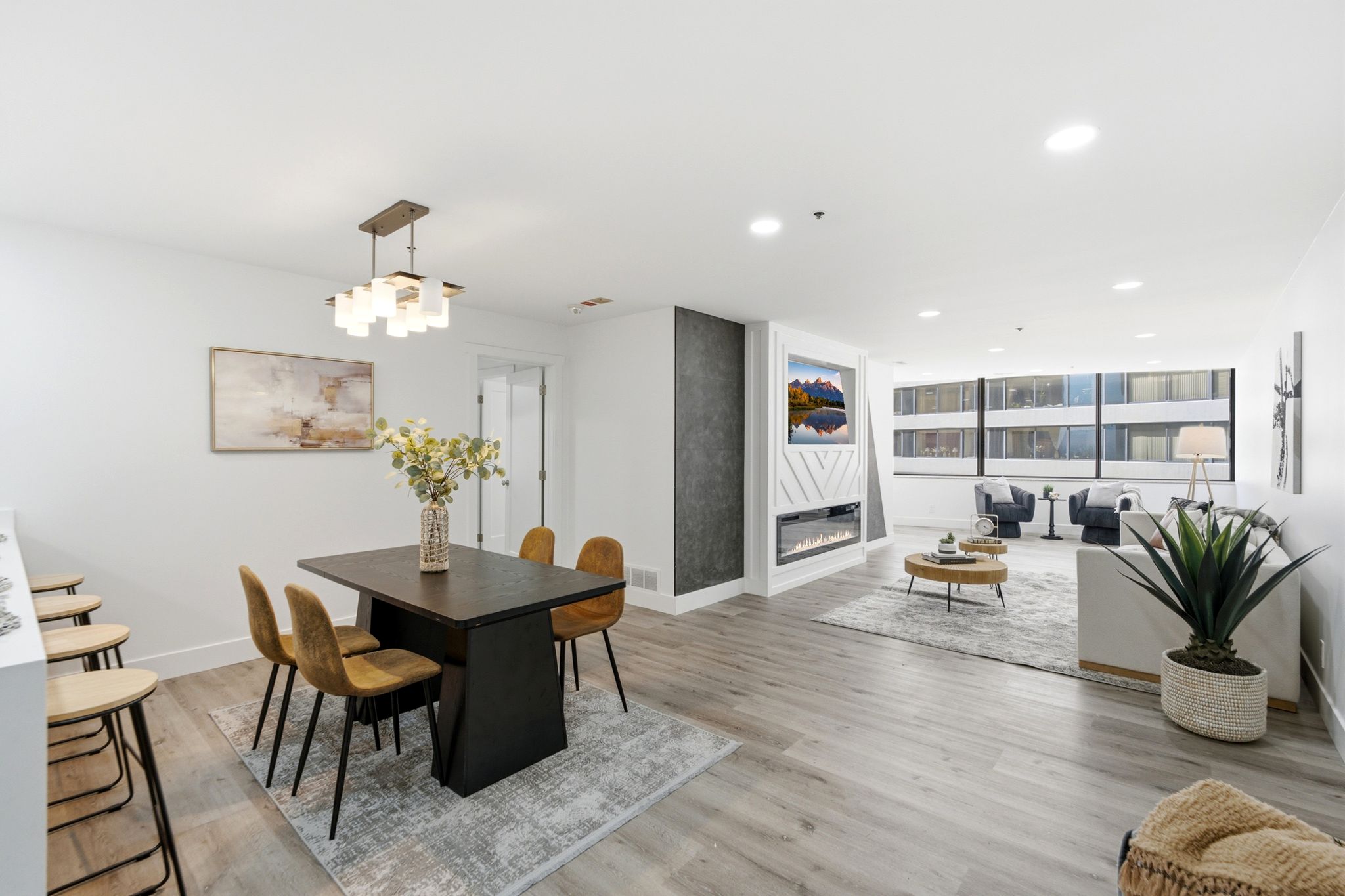Open concept living area featuring wood-finish flooring