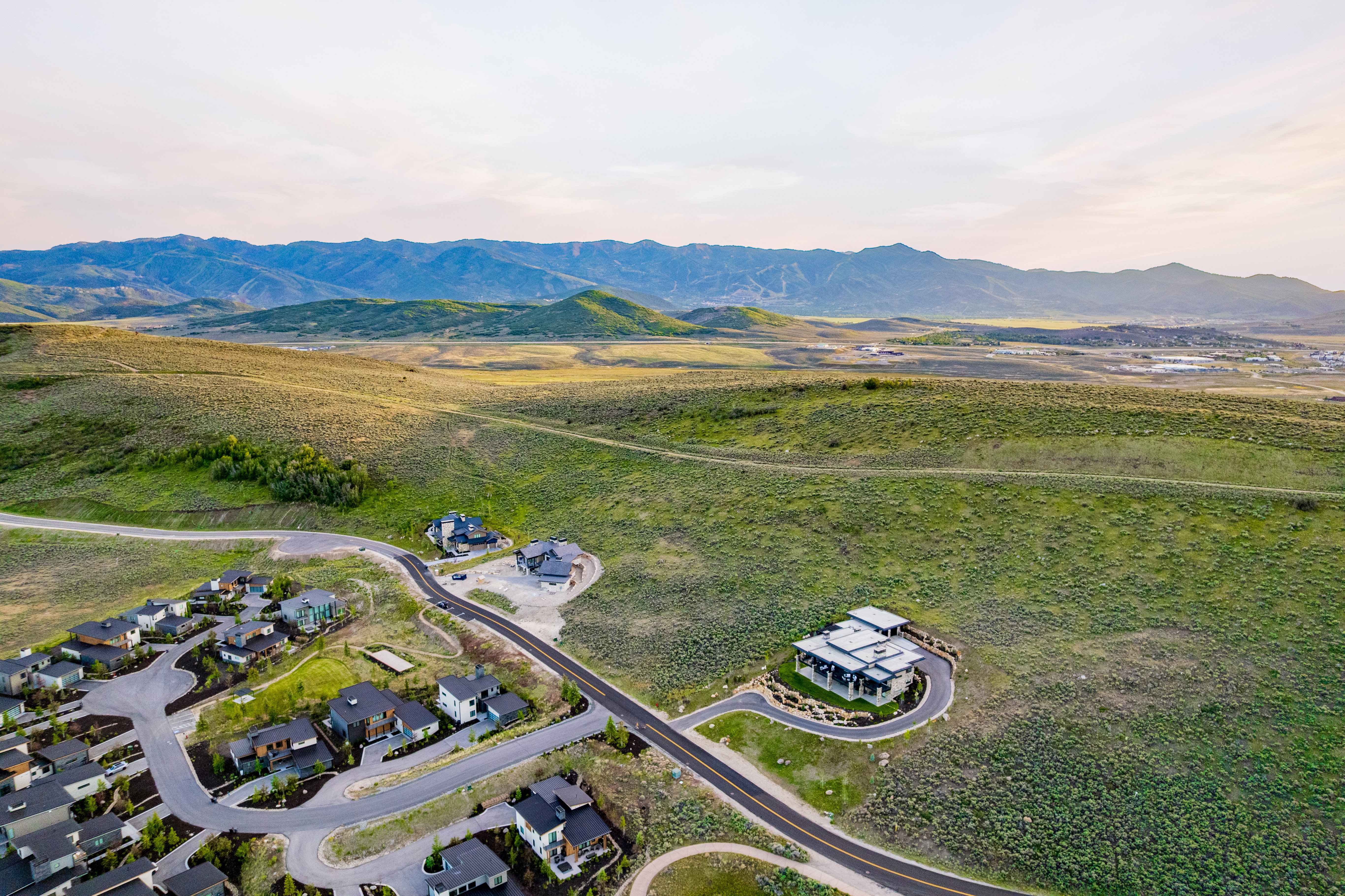 Expansive landscape featuring rolling hills and distant mountains