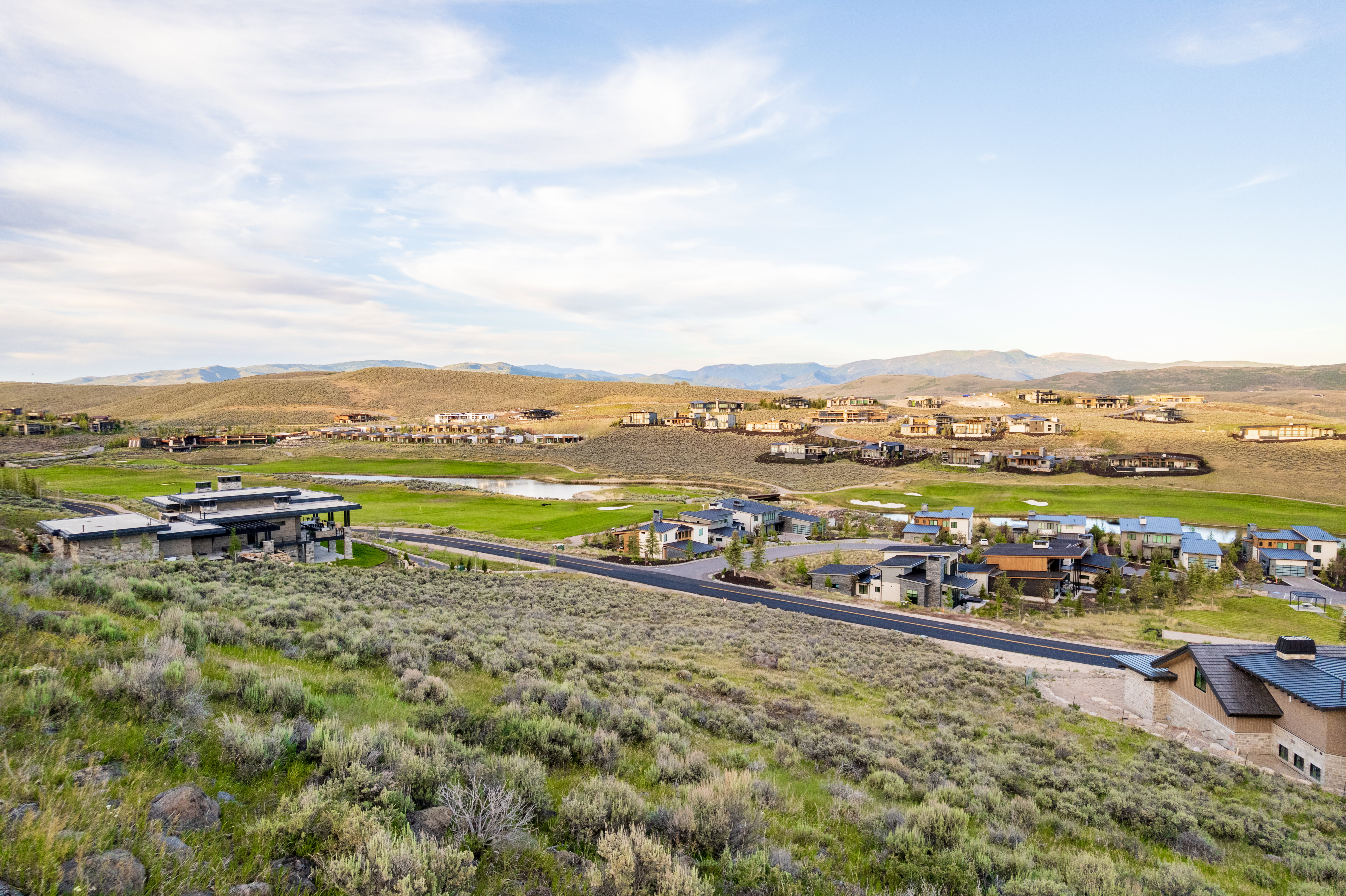 Expansive landscape featuring rolling hills and distant mountains