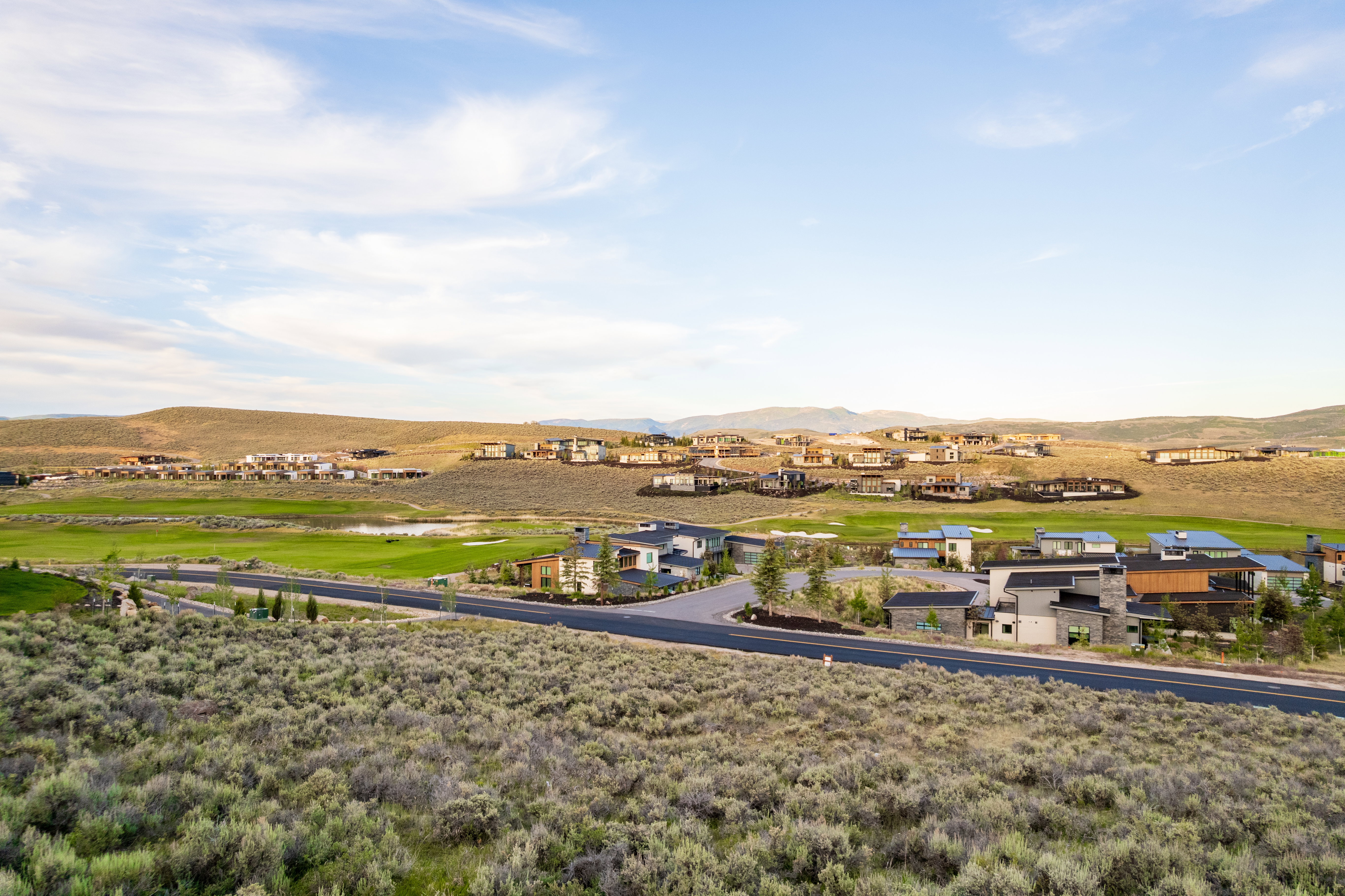 Expansive landscape featuring rugged terrain and distant mountain ranges