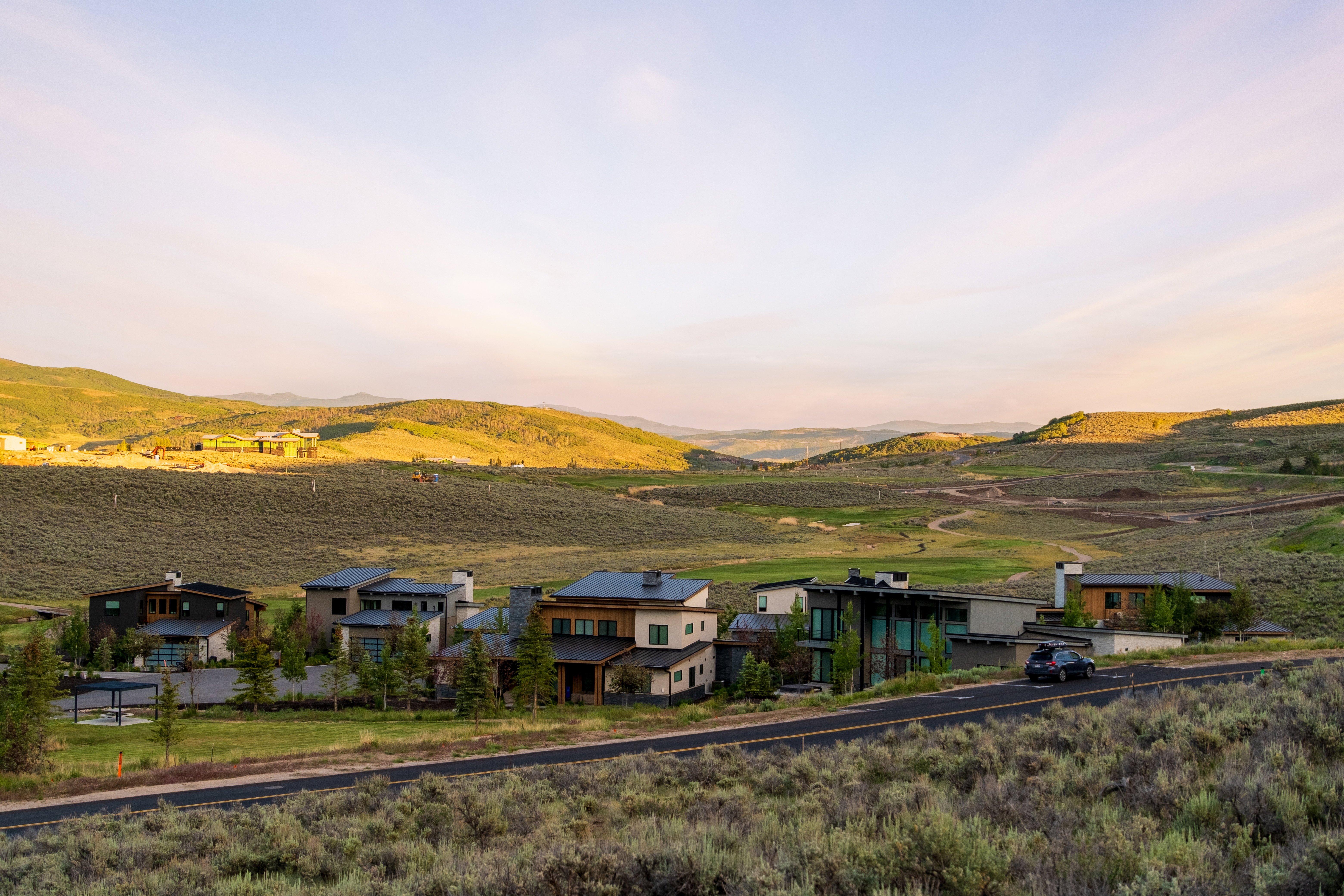 Scenic mountainous landscape with a collection of modern residences
