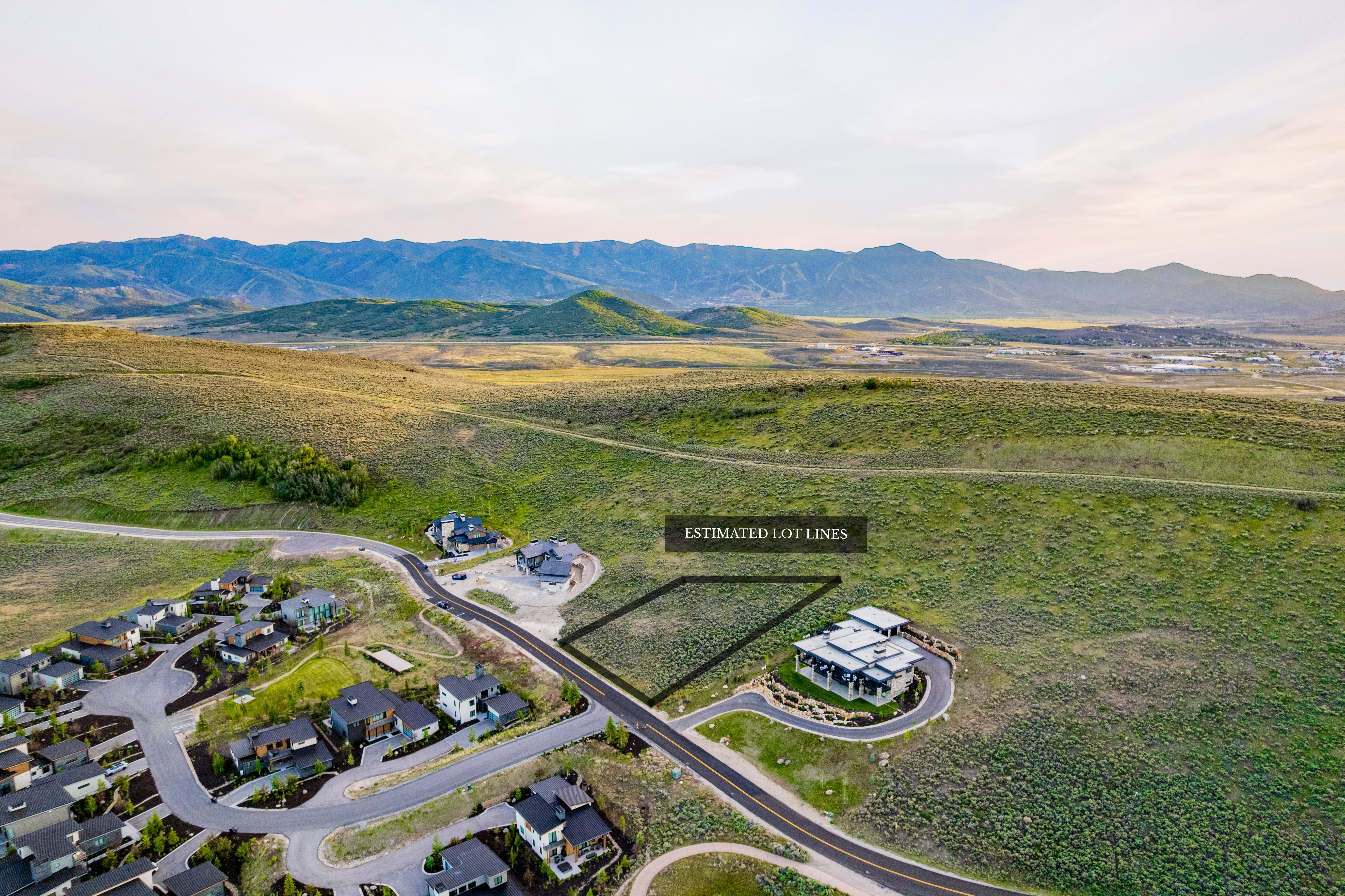 Expansive parcel of undeveloped land surrounded by natural landscape