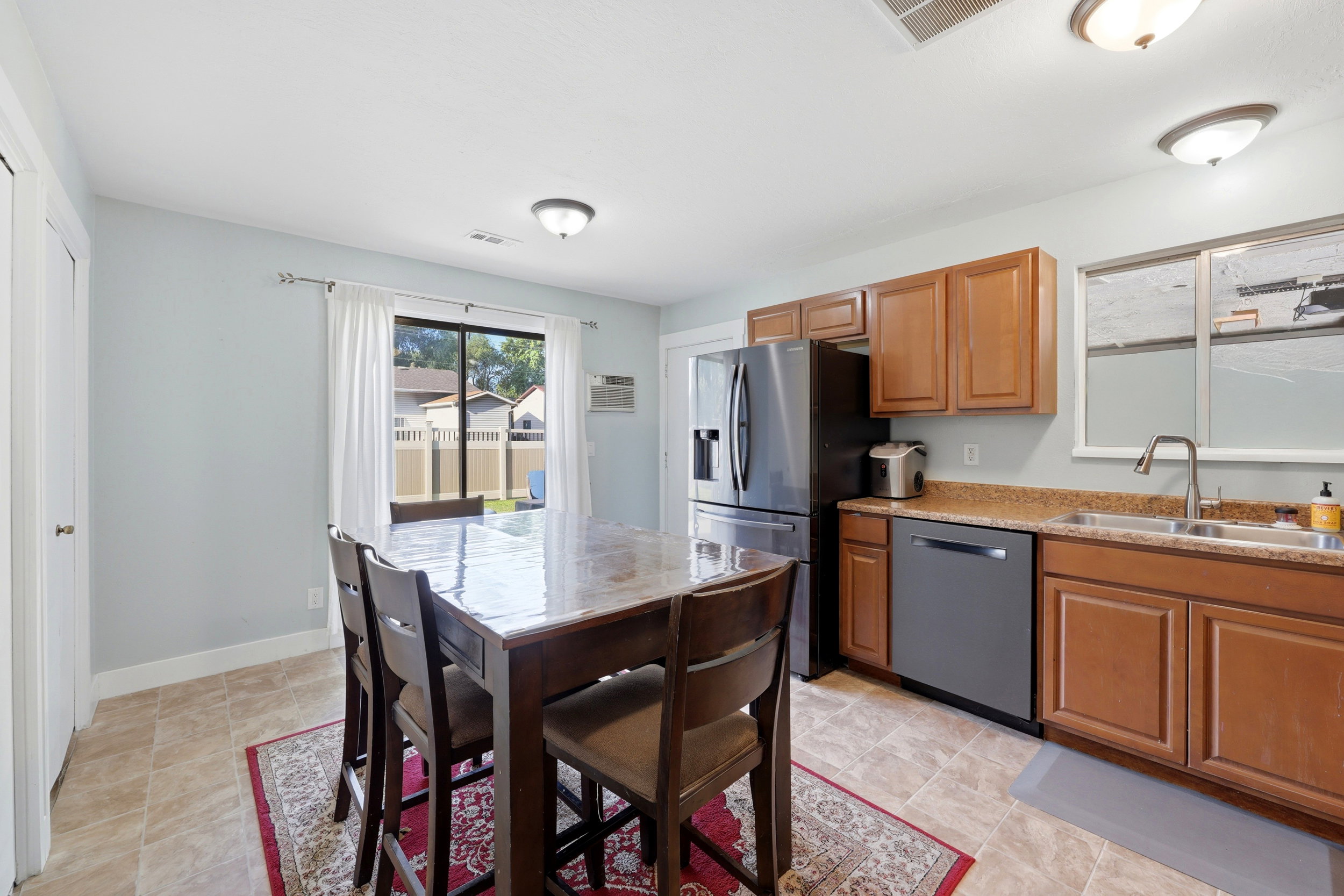 Kitchen featuring wood cabinetry, stainless steel appliances, and a light-toned countertop
