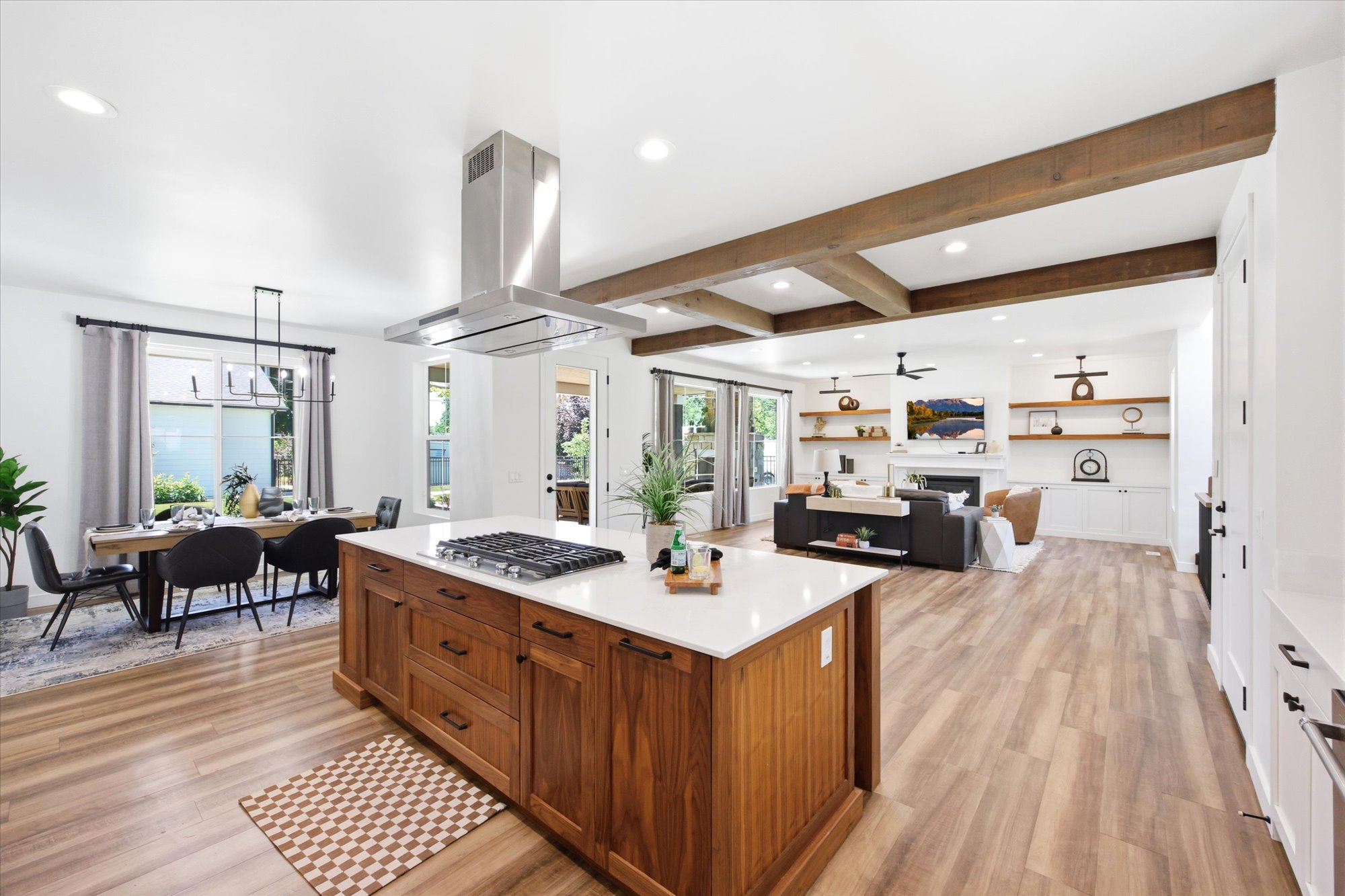 Open concept living space featuring wood-finish flooring