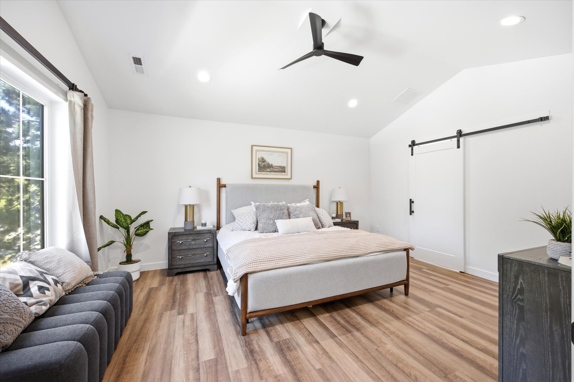 Vaulted ceiling featuring a contemporary ceiling fan and recessed lighting