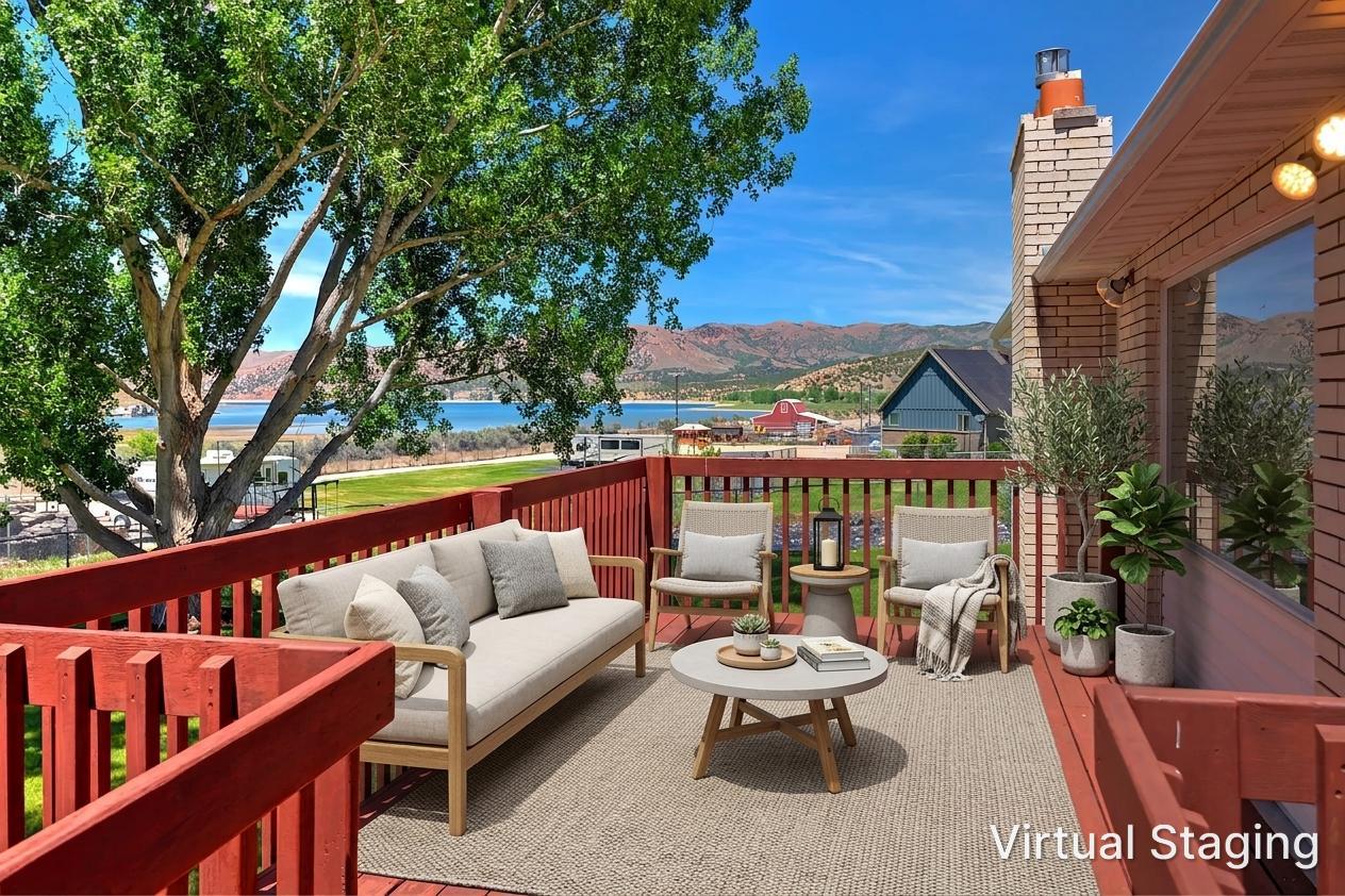Expansive deck featuring red-stained railings and a large window
