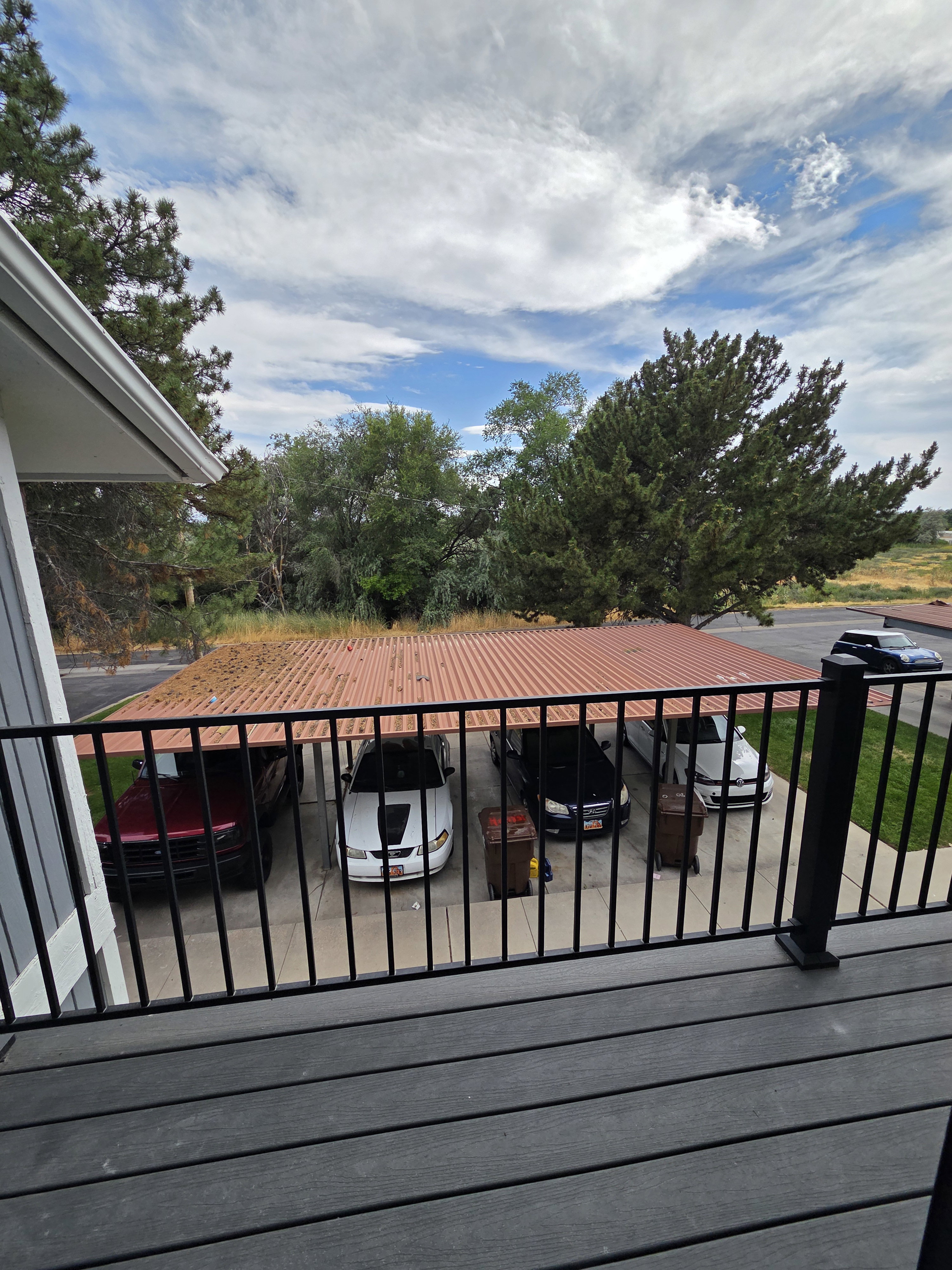 1 space carport next to plenty of guest parking, half basketball court, picnic tables, playground and community swimming pool.