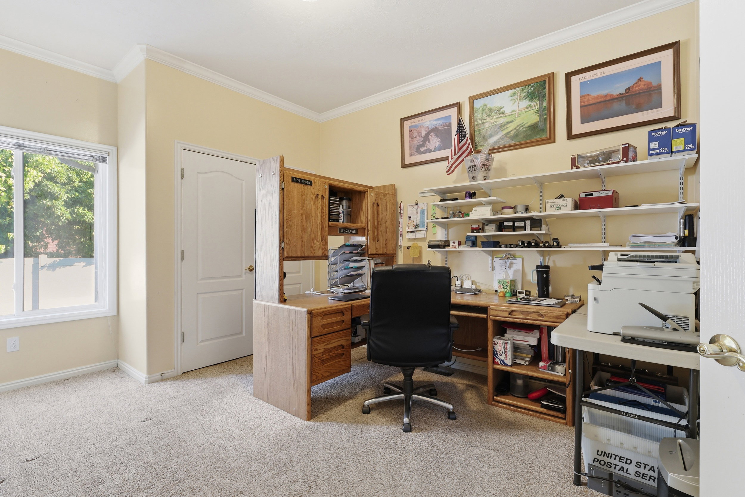 Carpeted interior space and a single window with white trim