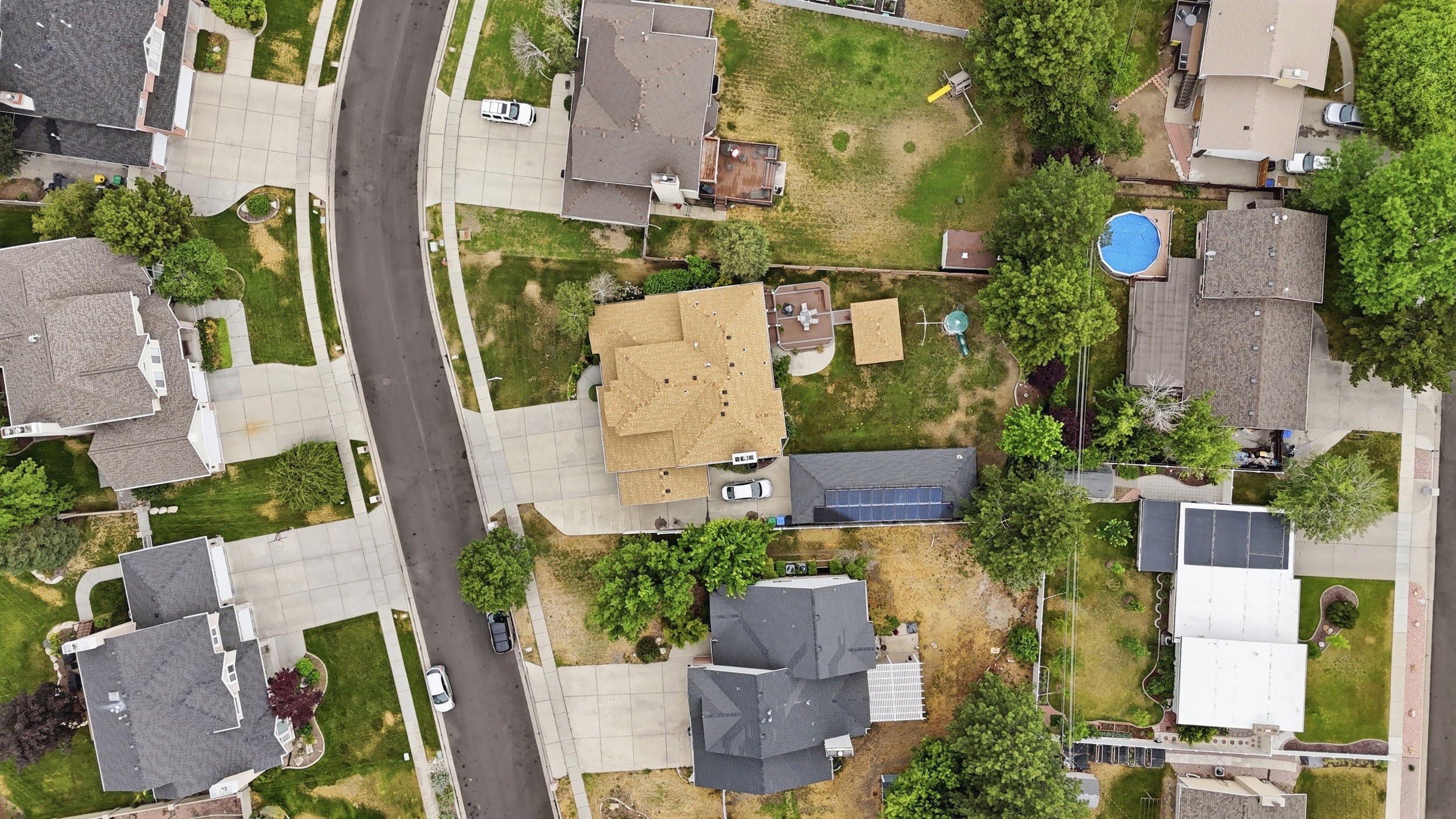 Aerial perspective of a residential neighborhood featuring several properties