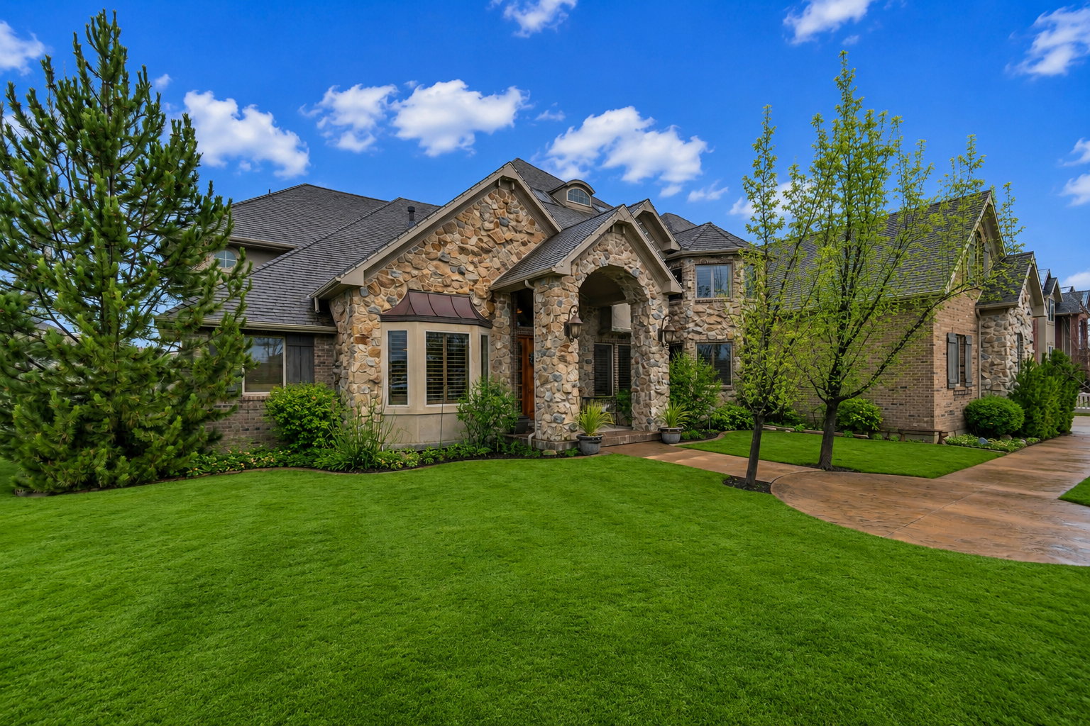 Stone and brick facade with an arched entry