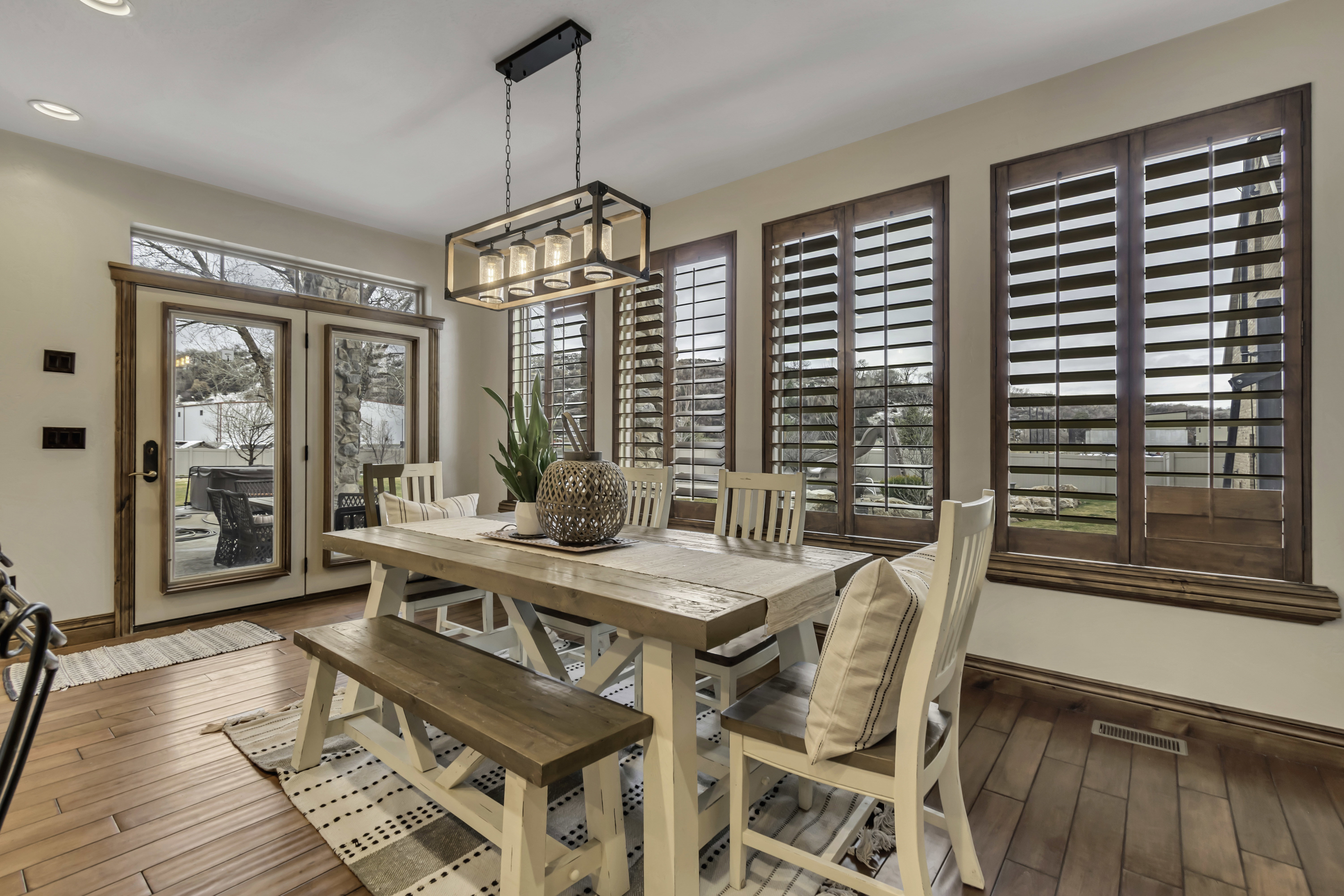 Warm-toned wood-finish flooring complements the light wall tones