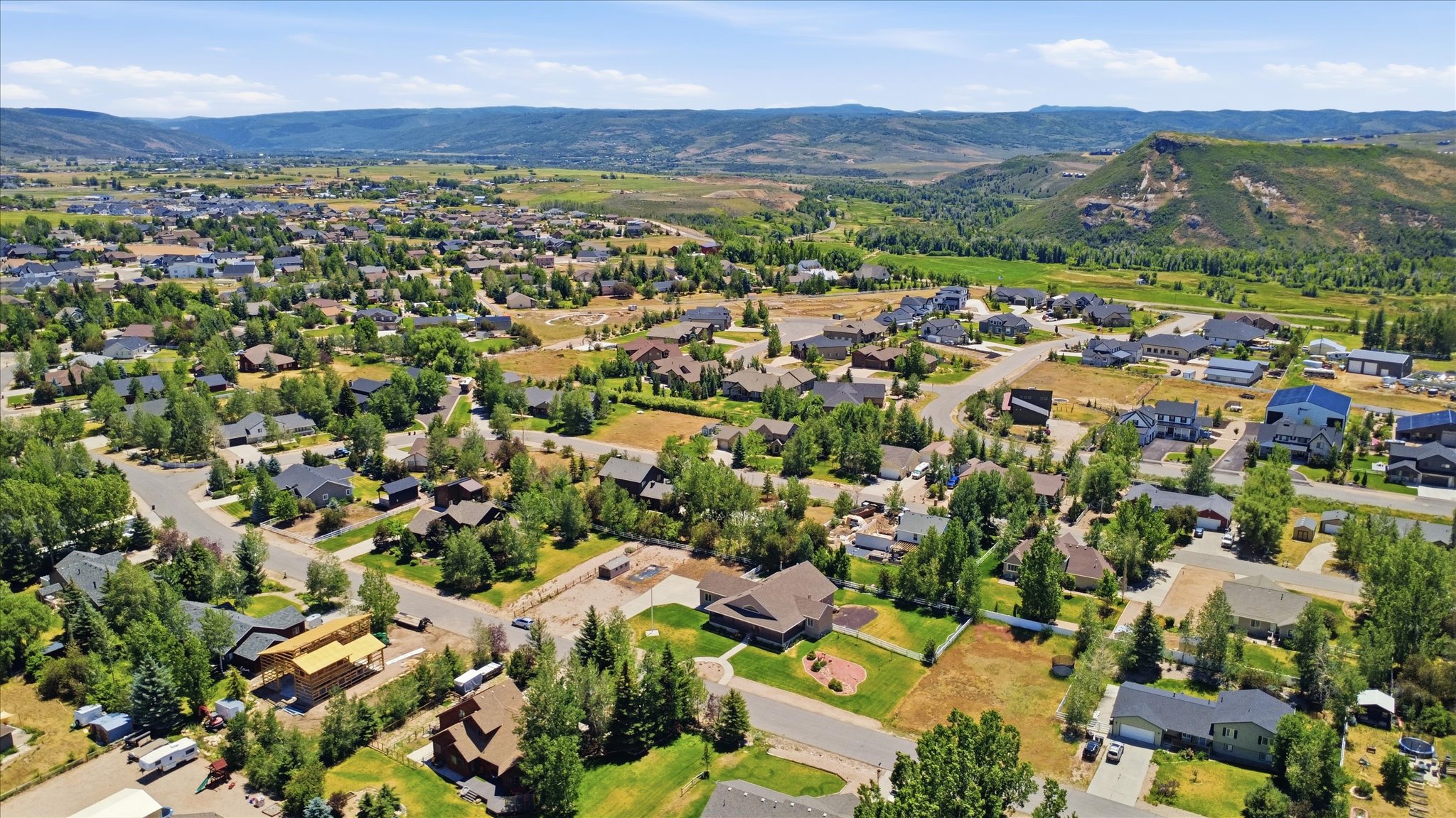 Expansive aerial perspective showcasing a residential development with varied architectural styles
