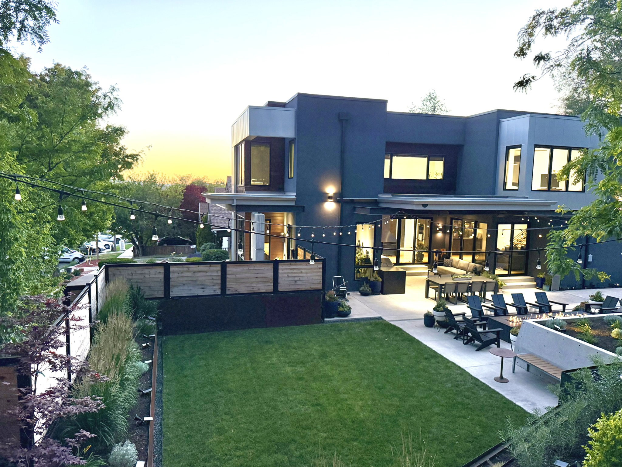 Contemporary multi-story exterior with multiple windows and recessed lighting