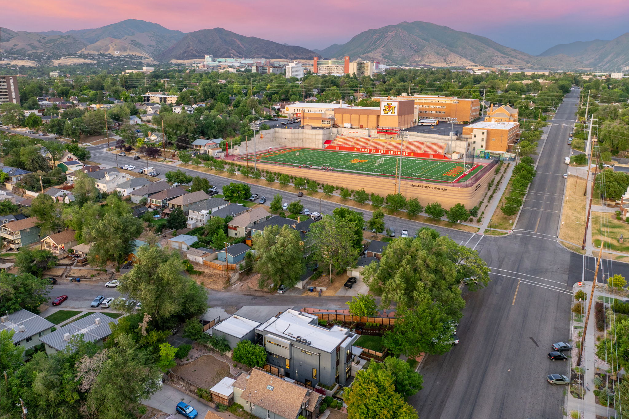 Aerial perspective showcasing a dense urban neighborhood with varied residential architecture