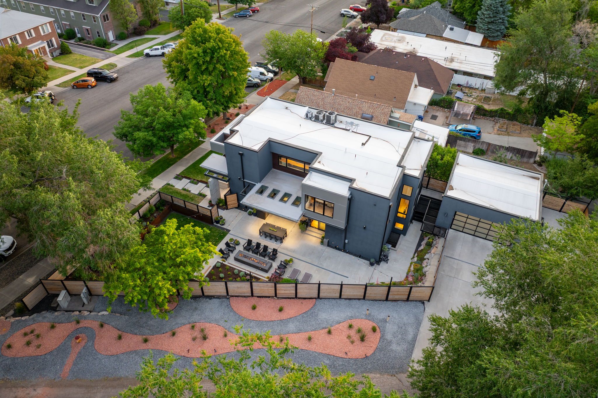 Modern architectural residence featuring a flat roofline and dark grey exterior paneling