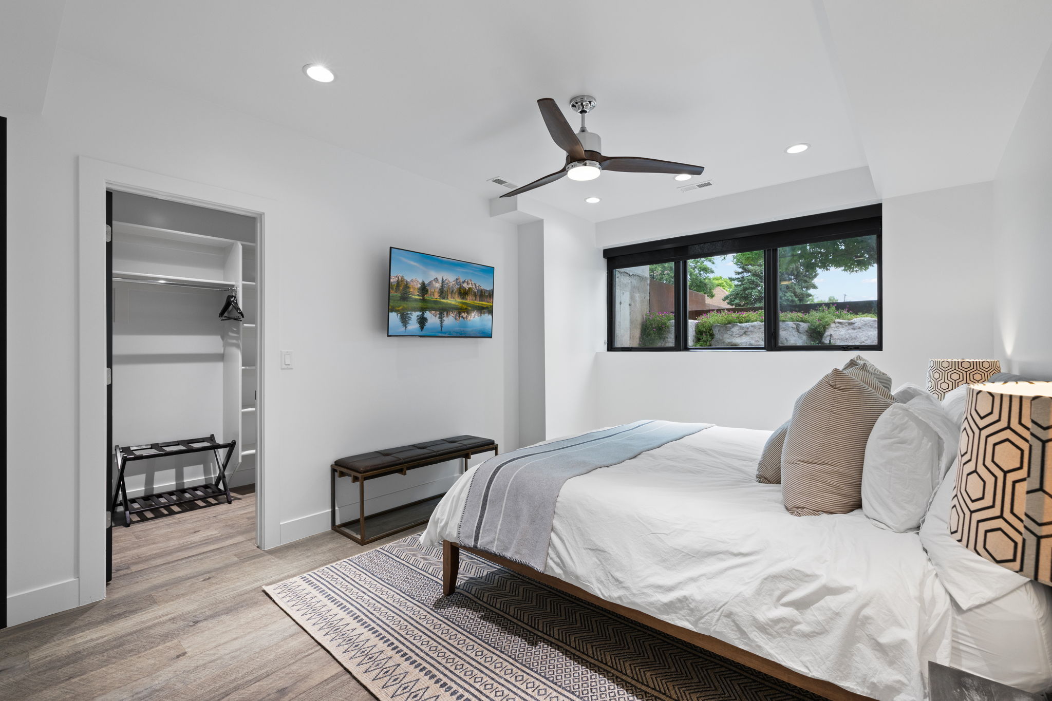 Bedroom featuring wood-finish flooring, recessed lighting, and a modern ceiling fan