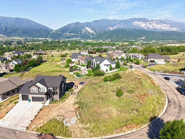 Expansive residential property featuring a modern two-story residence with a two-car garage and a concrete driveway