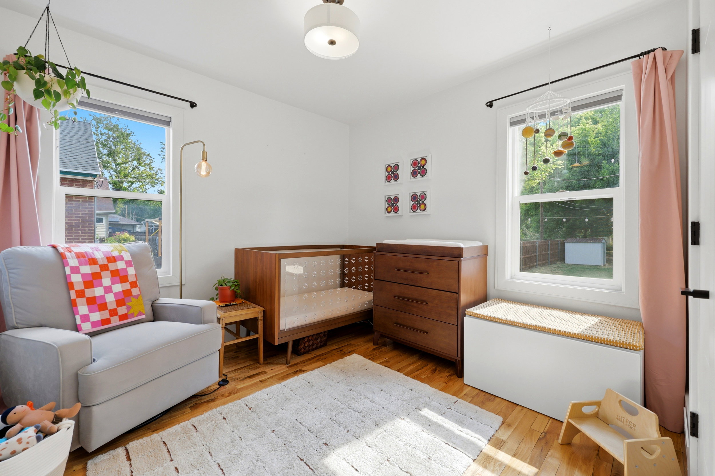 Hardwood flooring extending throughout, complemented by white walls and trim