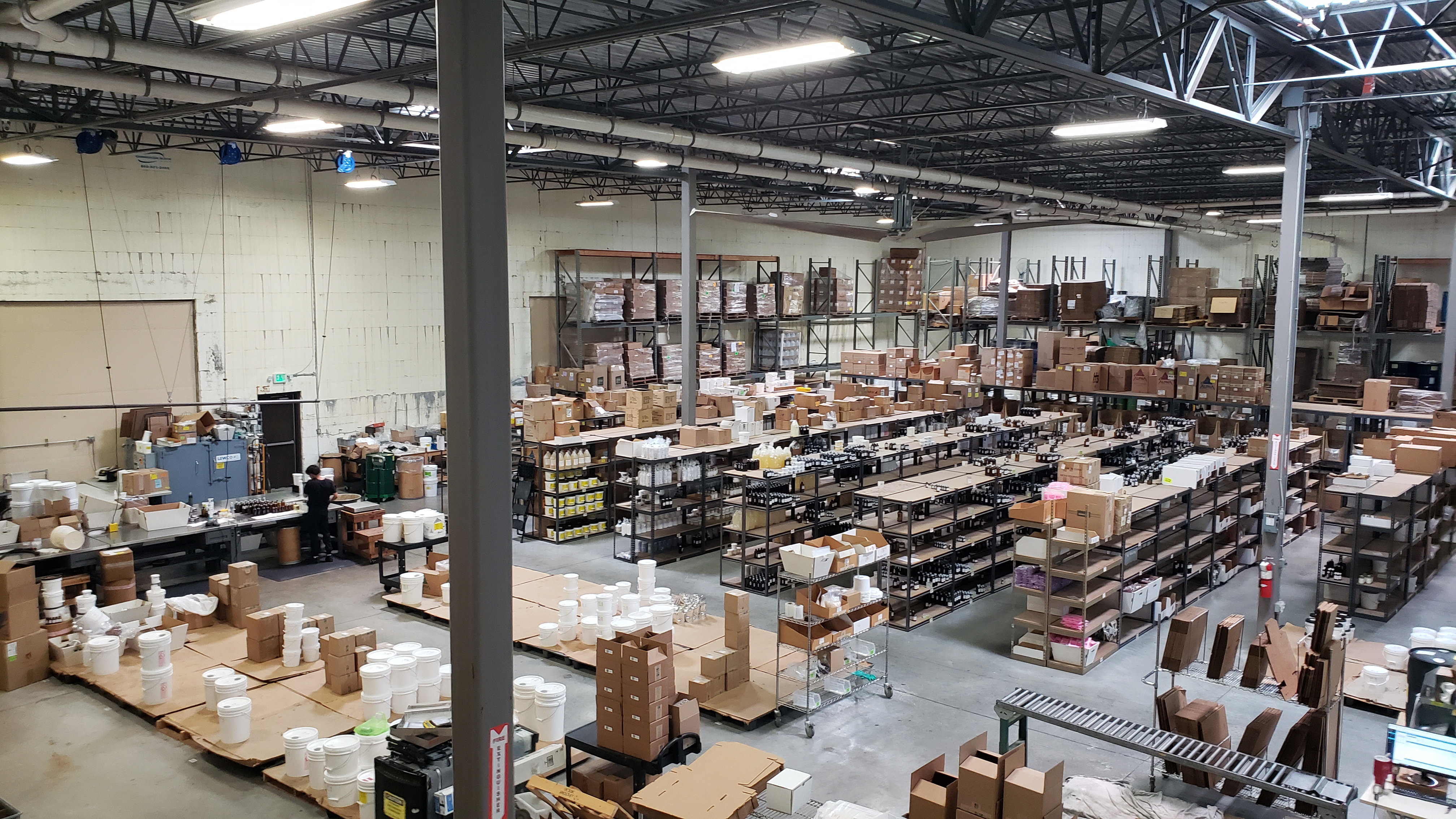 Expansive industrial warehouse space with high ceilings and exposed structural elements