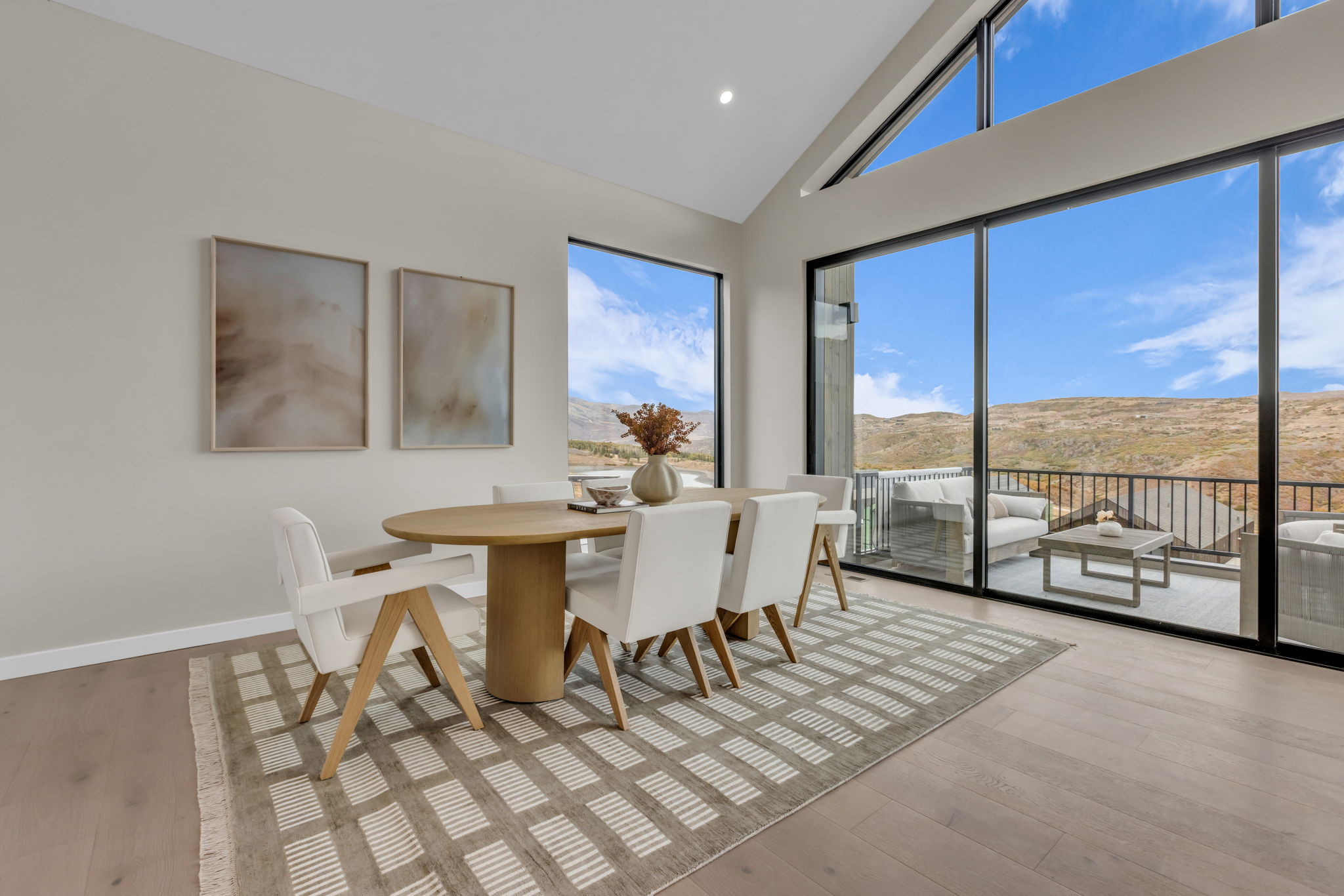 Spacious room with vaulted ceilings and wood-finish flooring
