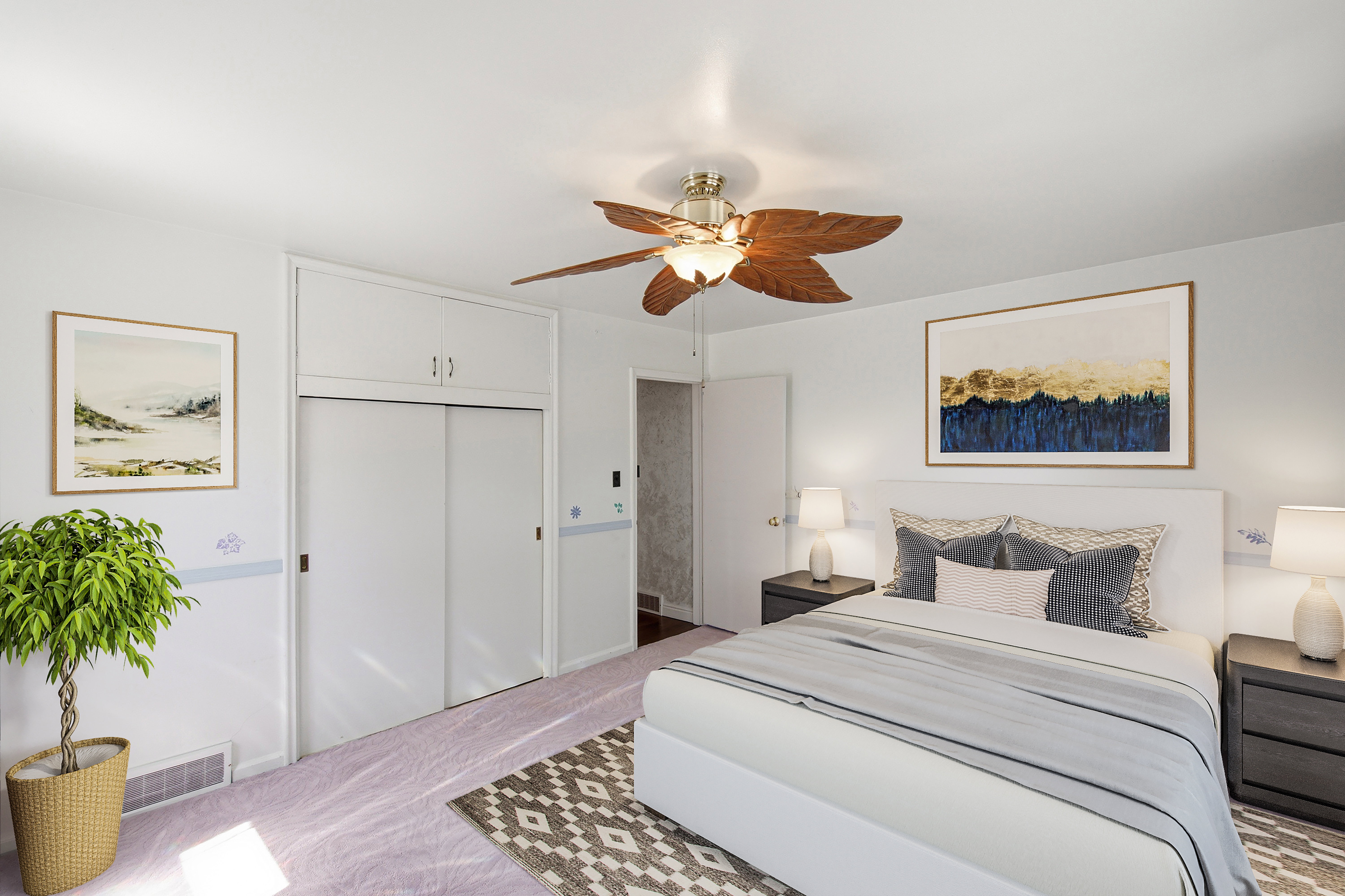 Bedroom featuring a ceiling fan, light-colored carpeting, built-in closet with sliding doors, and overhead cabinetry