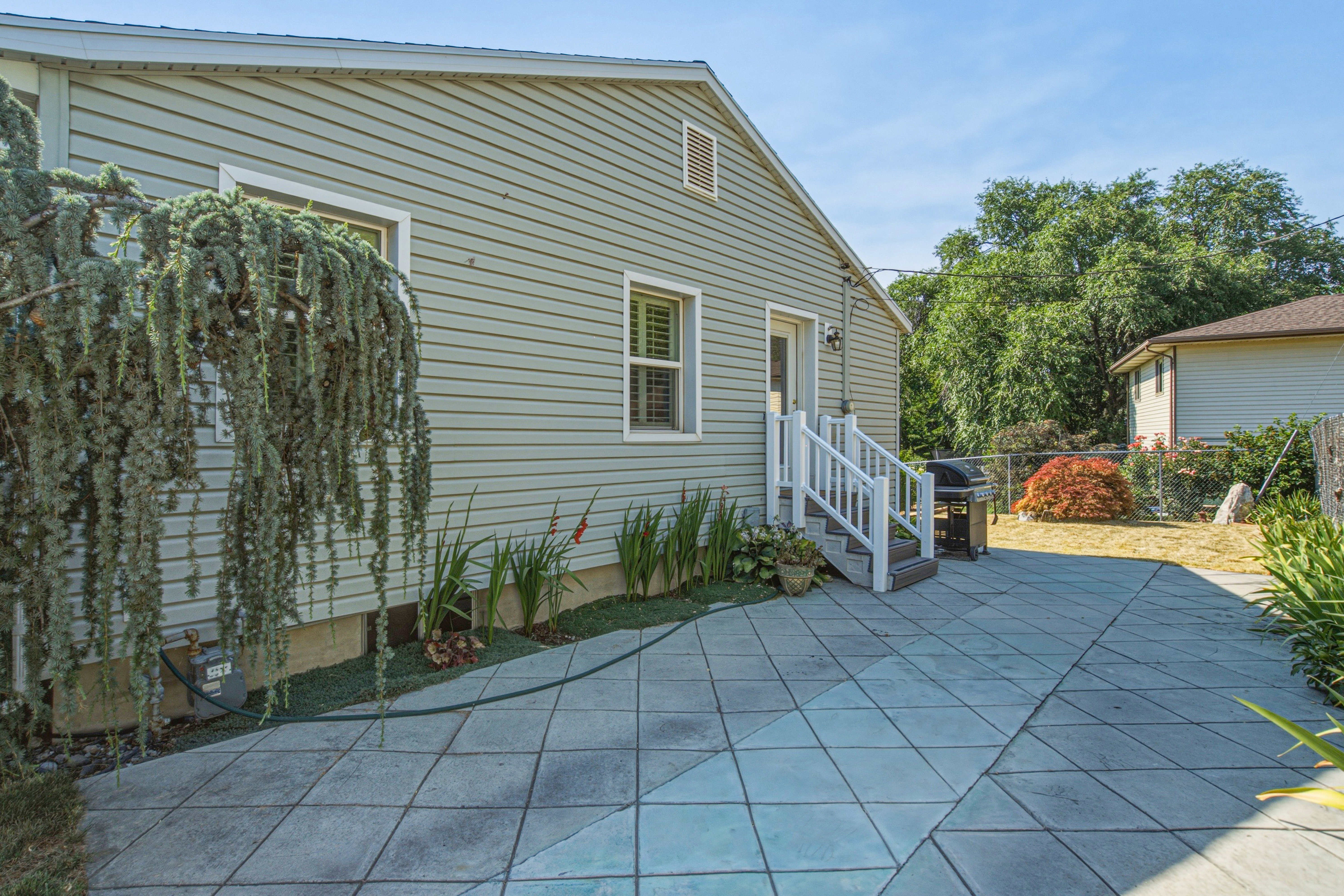 Expansive paver patio featuring a geometric pattern