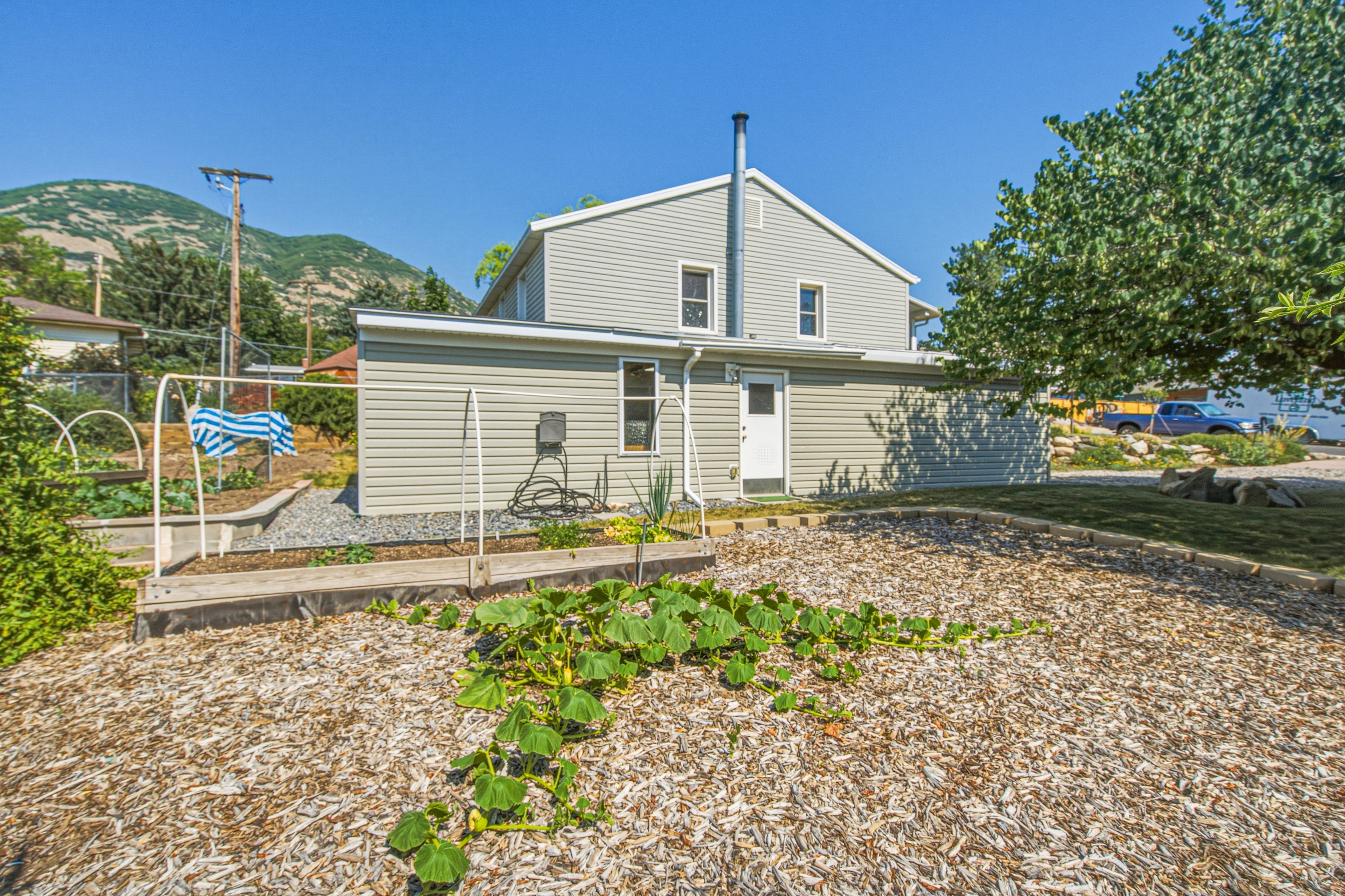Rear exterior featuring horizontal siding and multiple windows