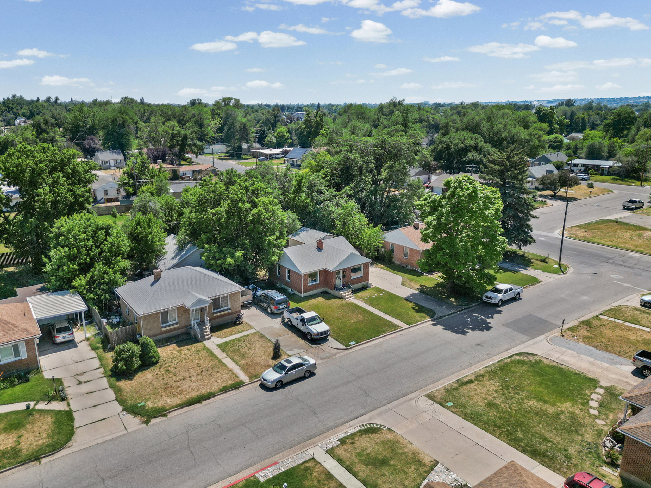 Residential neighborhood featuring mature trees and street-level curb appeal